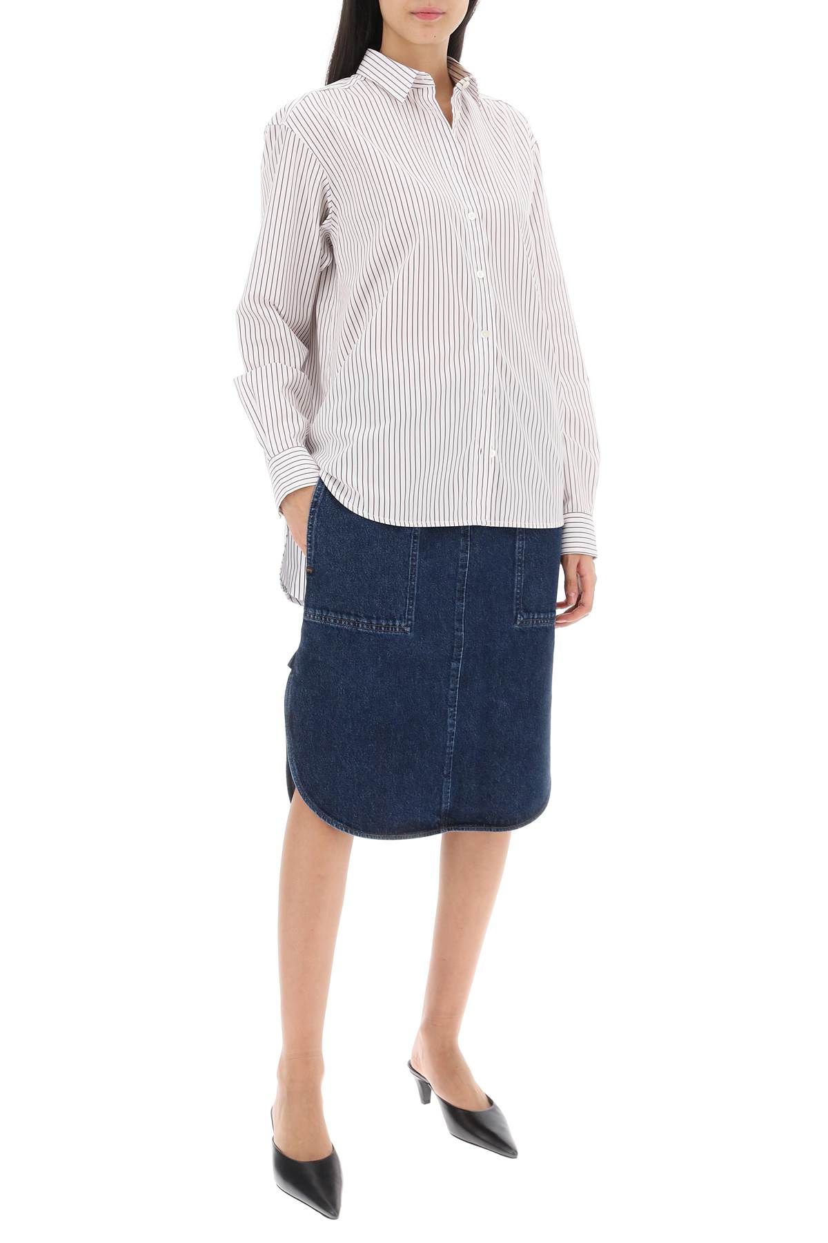 Shop Totême Curved Hem Denim Skirt In Blue