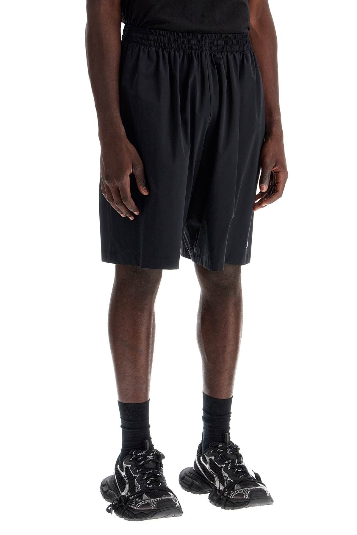 Shop Balenciaga Nylon Stretch Activewear Bermuda Shorts In Black