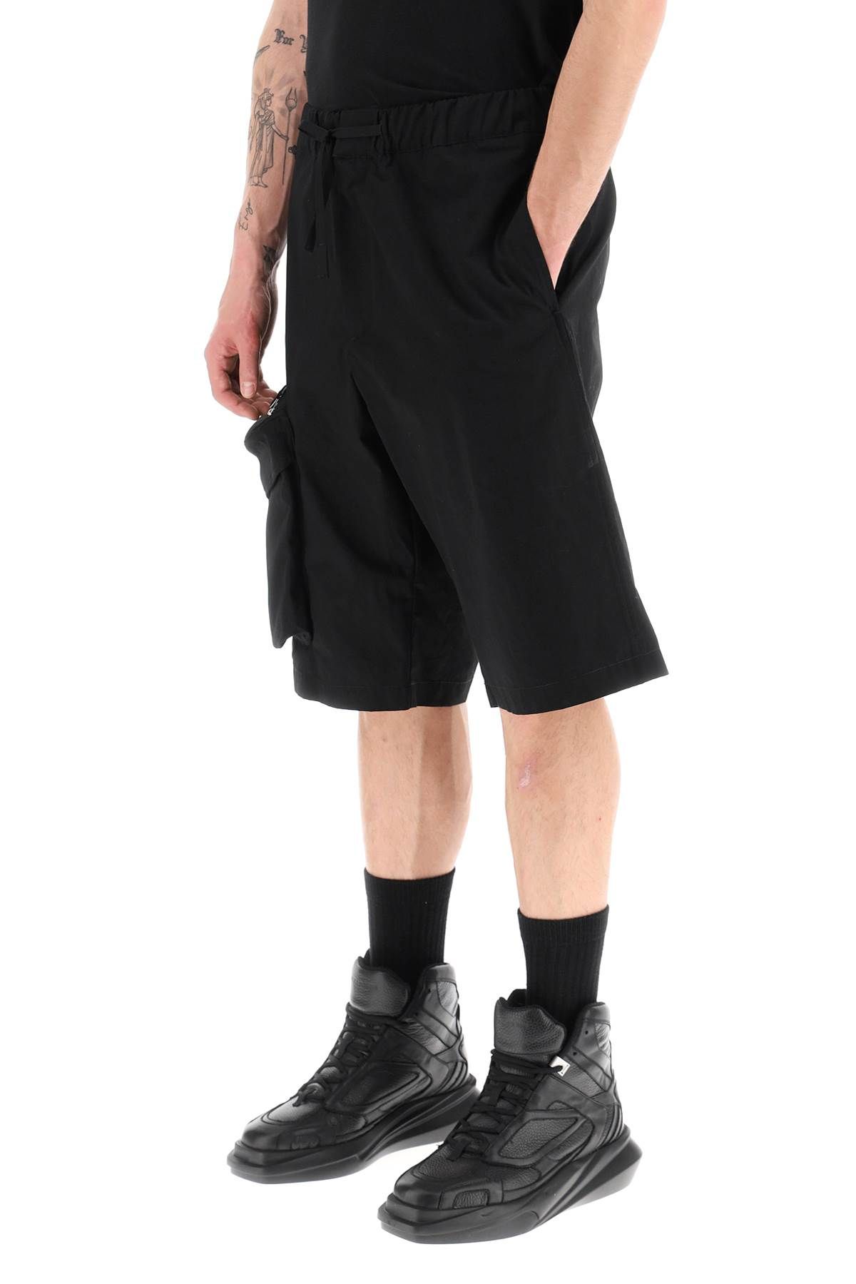 Shop Oamc Oversized Shorts With Maxi Pockets In Black