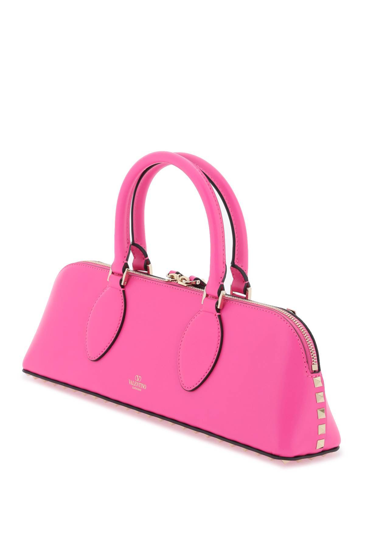 Shop Valentino Rockstud E/w Leather Handbag In Fuchsia