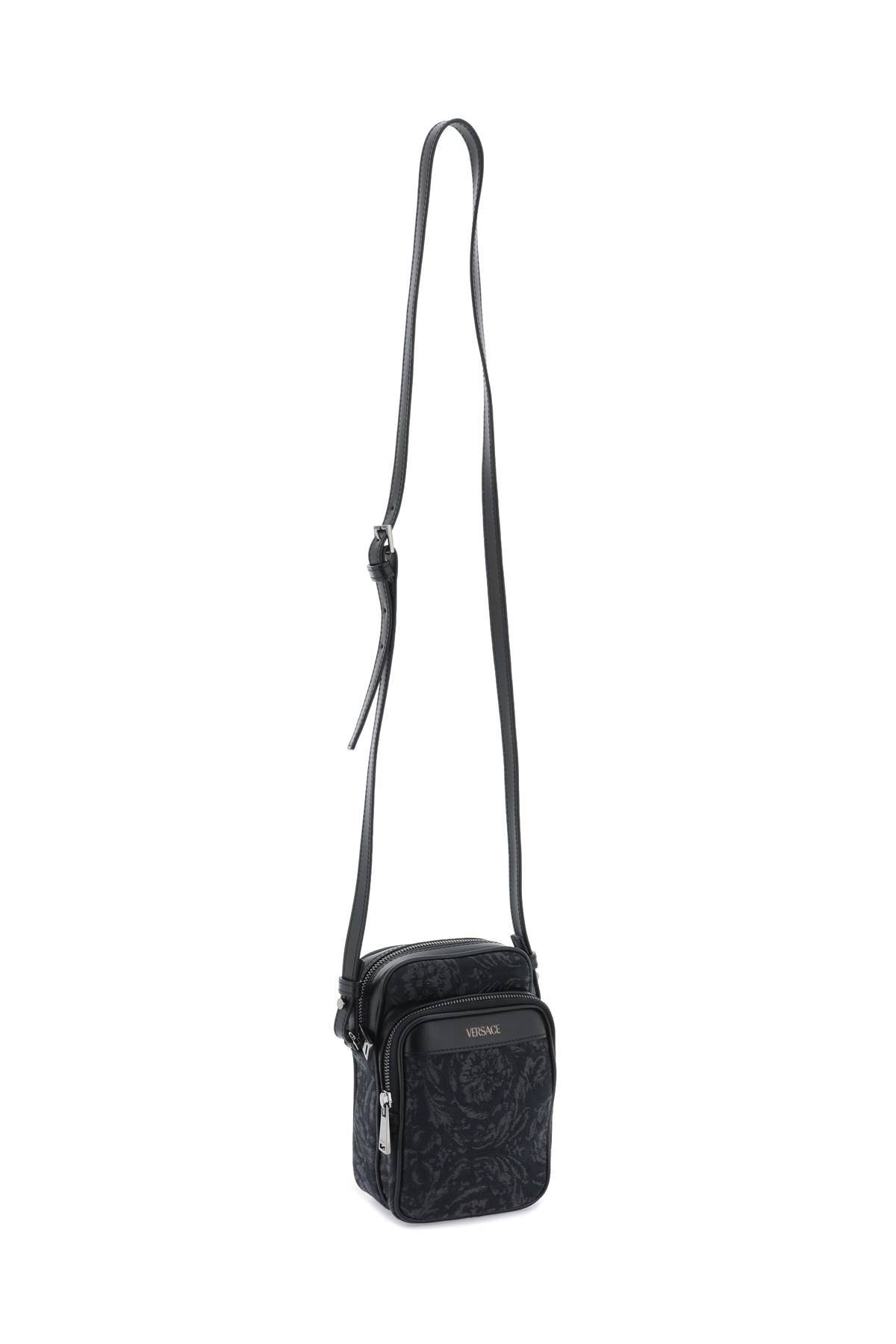 Shop Versace Athena Barocco Crossbody Bag In Black