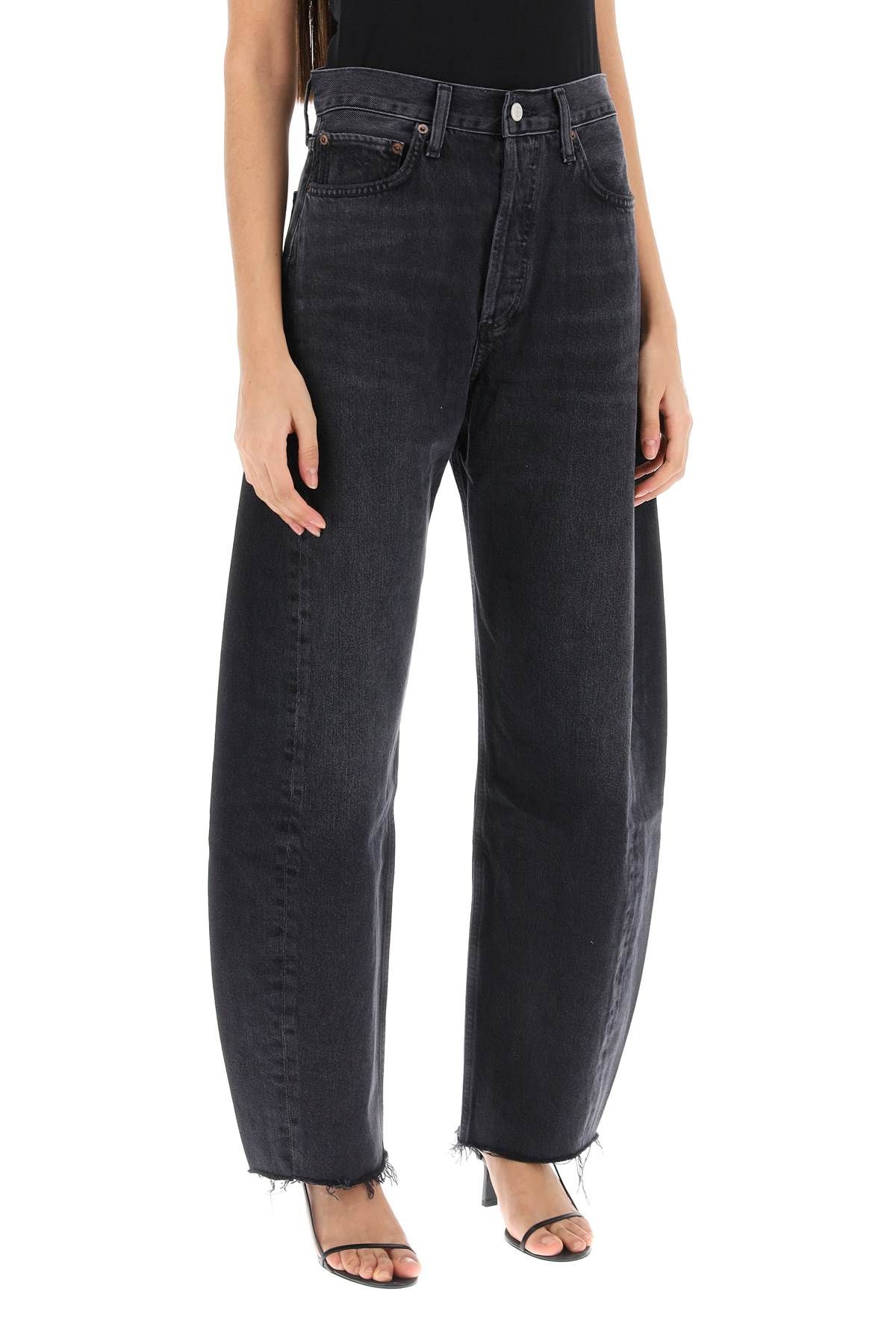 Shop Agolde Luna Curved Leg Jeans In Black