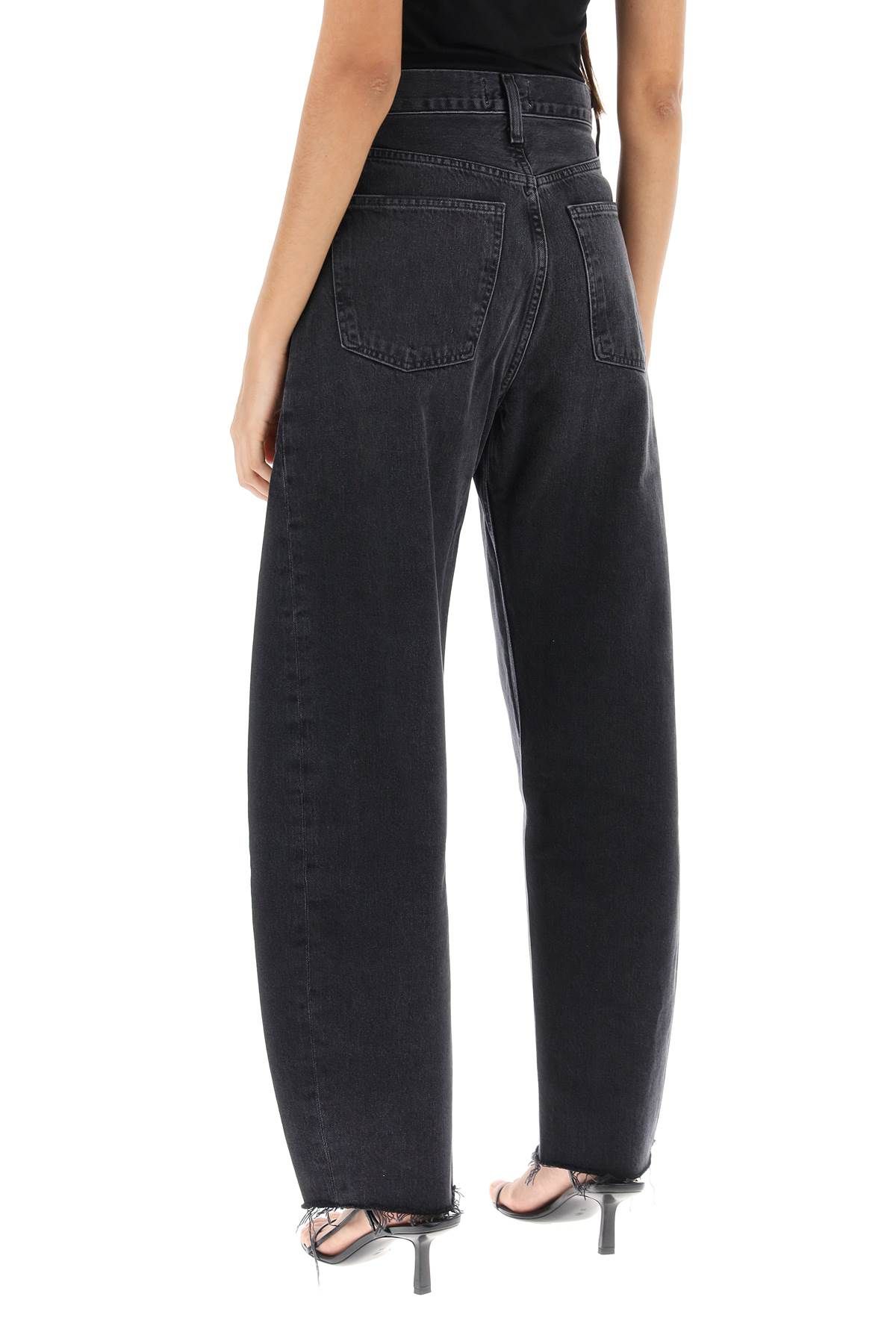 Shop Agolde Luna Curved Leg Jeans In Black