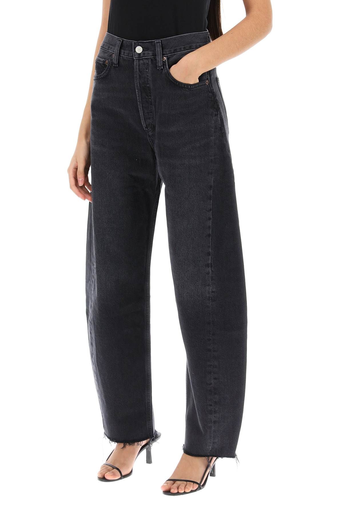 Shop Agolde Luna Curved Leg Jeans In Black