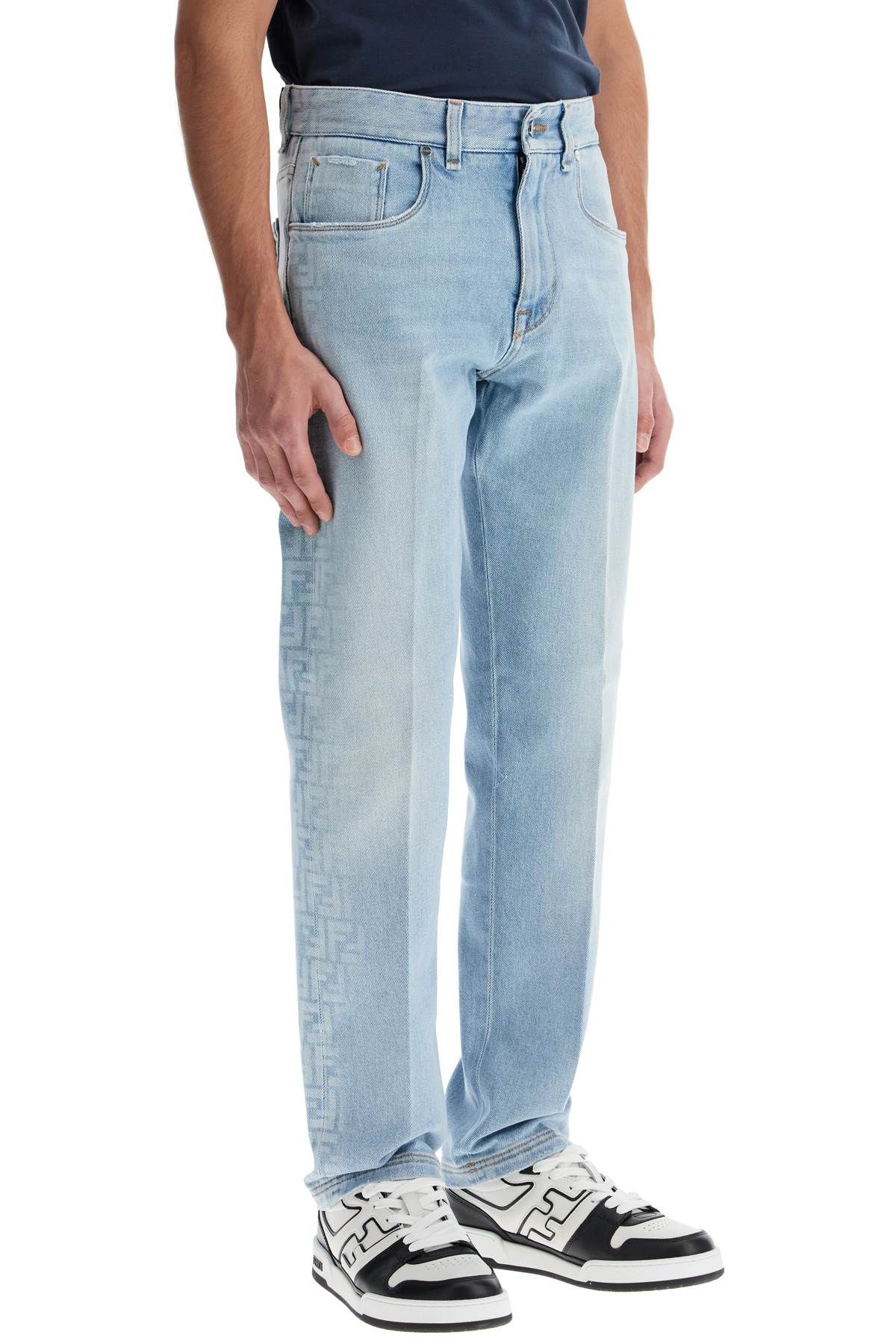 Shop Fendi Faded Ff Pattern Jeans With In Light Blue