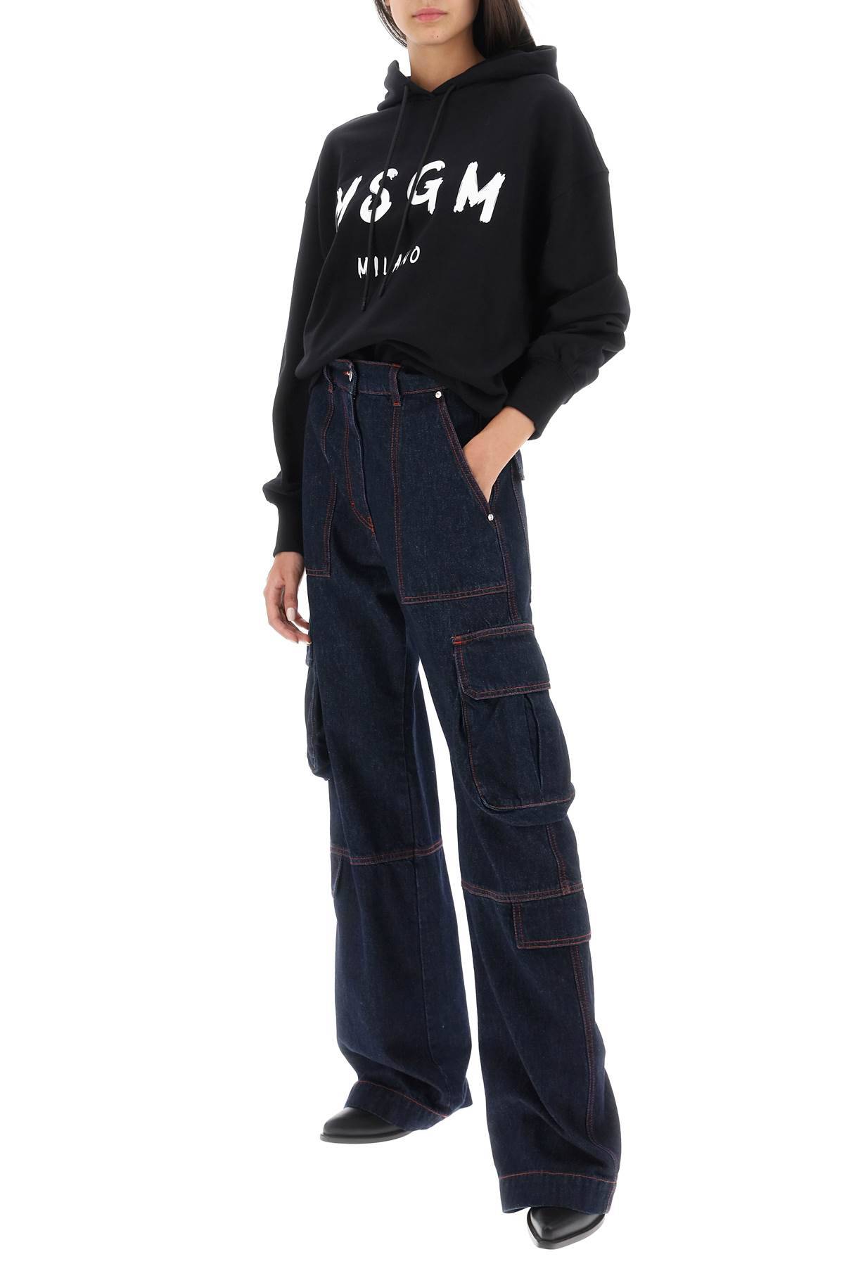 Shop Msgm Cargo Jeans With Flared Cut In Blue