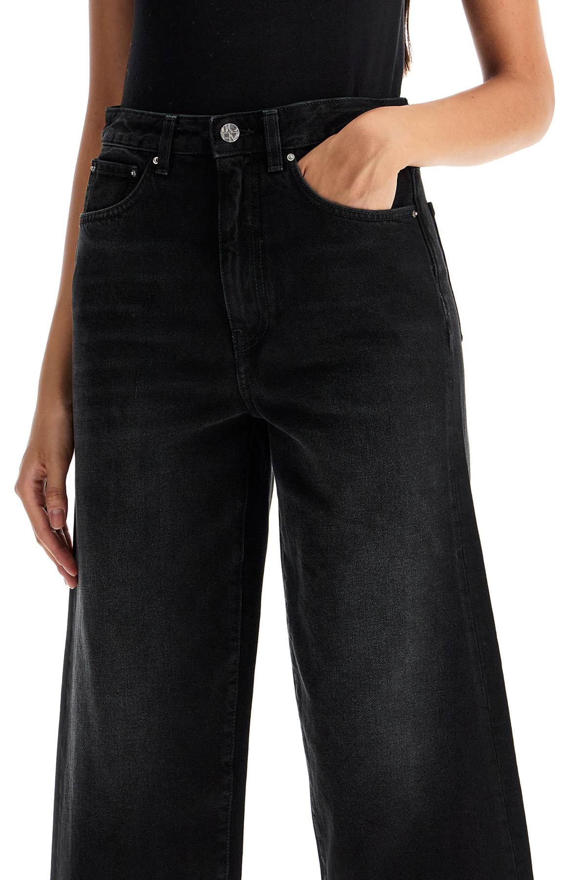 Shop Totême Cropped And Flared Jeans In Black