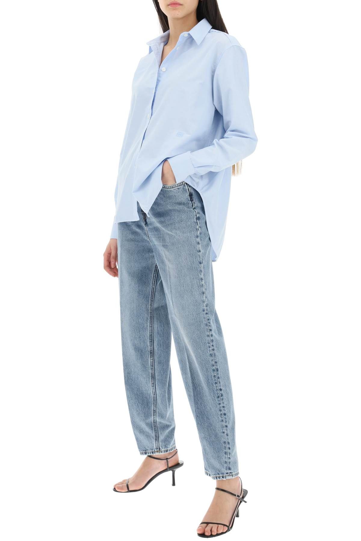 Shop Totême Organic Denim Tapered Jeans In Blue