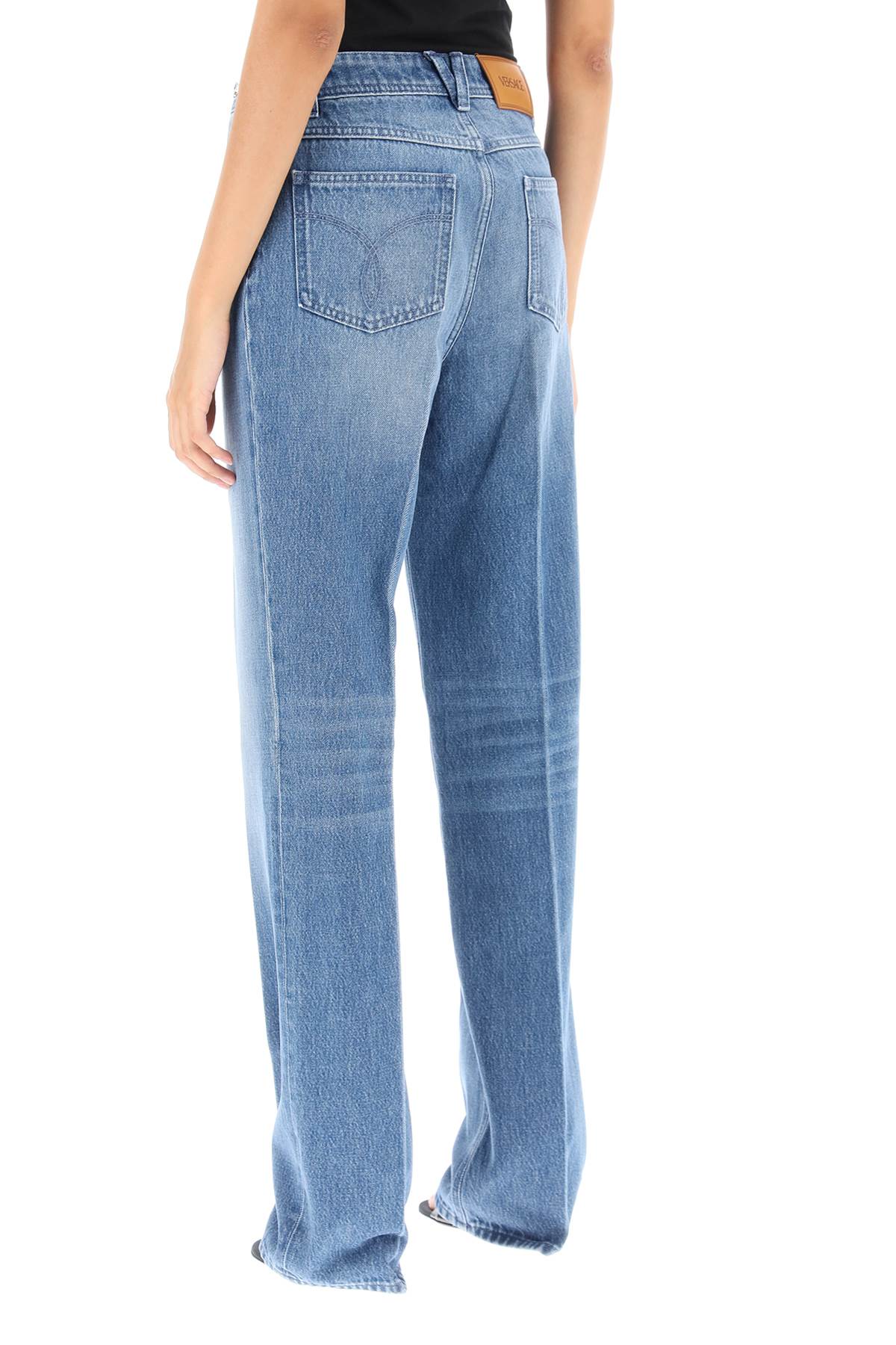 Shop Versace Boyfriend Jeans With Tailored Crease In Blue