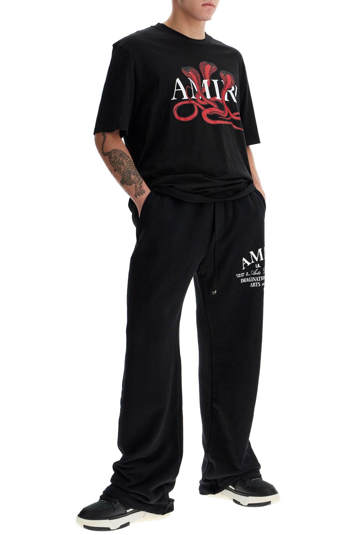 Shop Amiri Arts District Joggers In Black