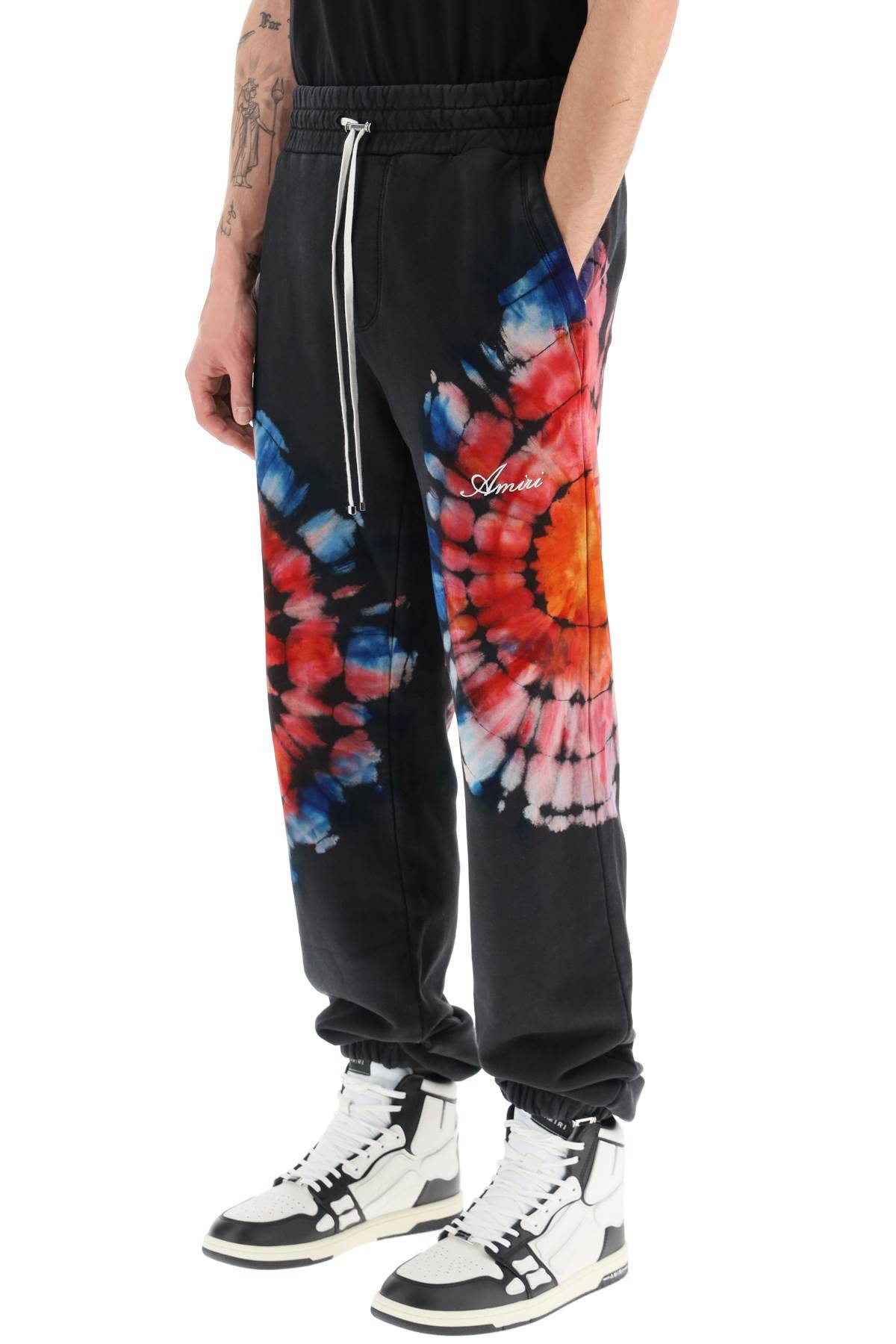 Shop Amiri Spot Tie-dye Jogger Pants In Black,multicolor