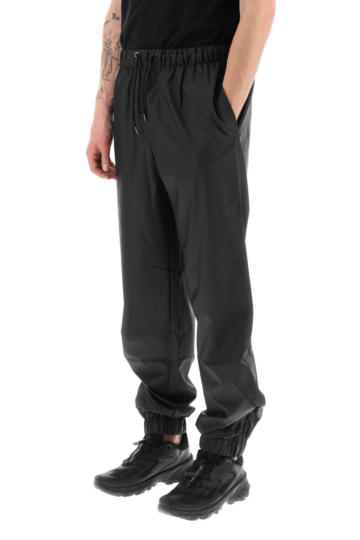 Shop Rains Water-repellent Pants In Black