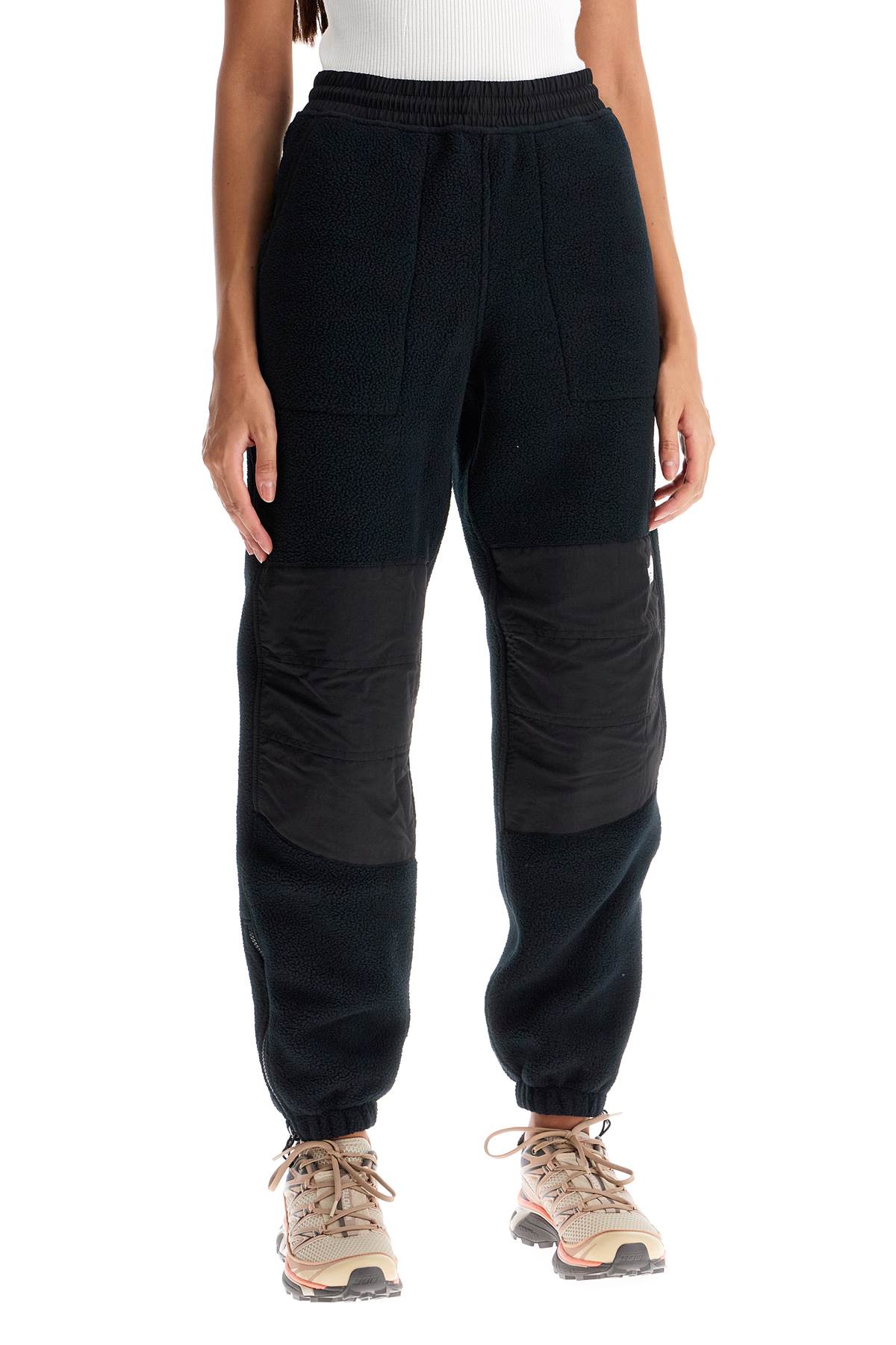 Shop The North Face Retro Denali Fleece Sports Pants. In Black