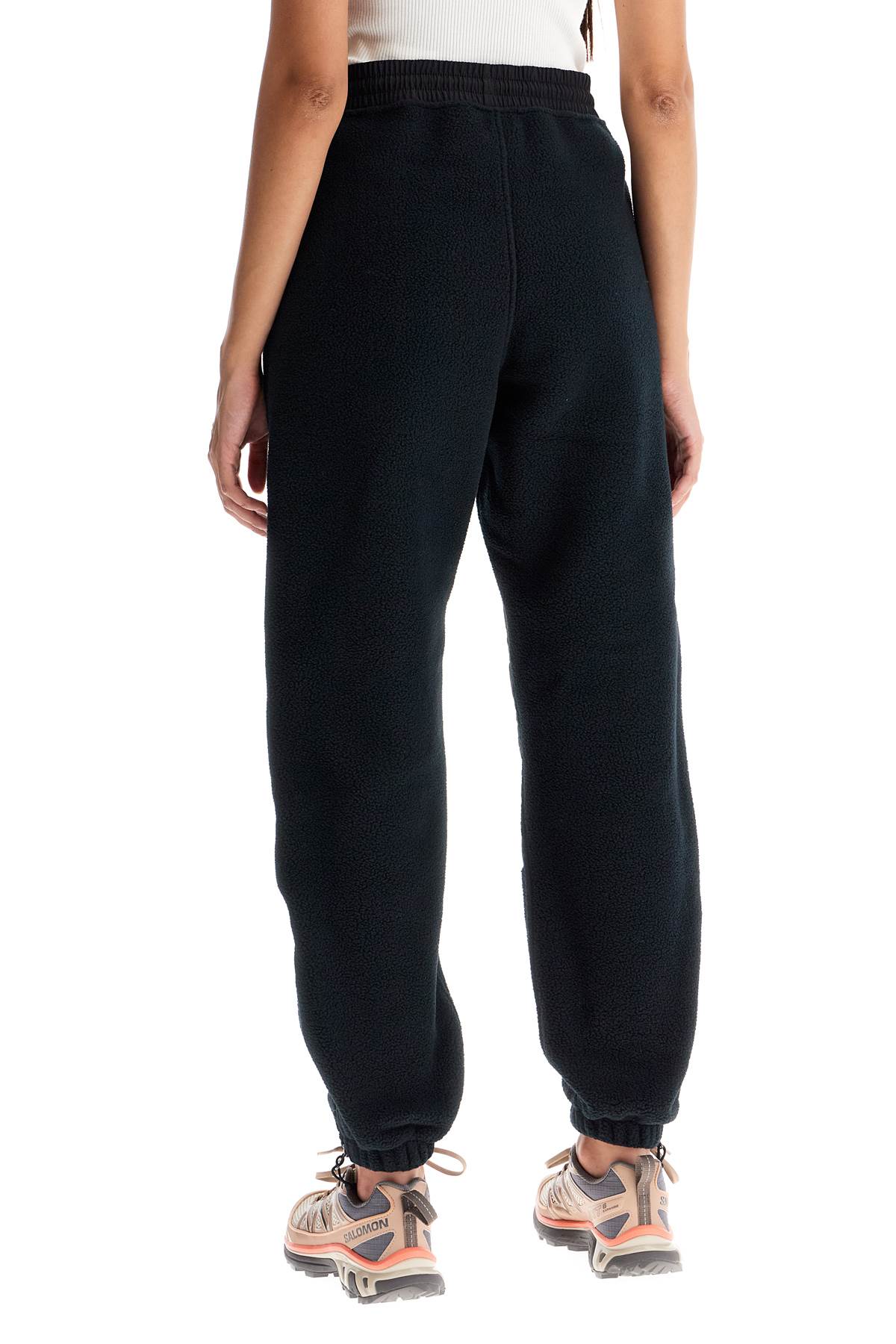 Shop The North Face Retro Denali Fleece Sports Pants. In Black