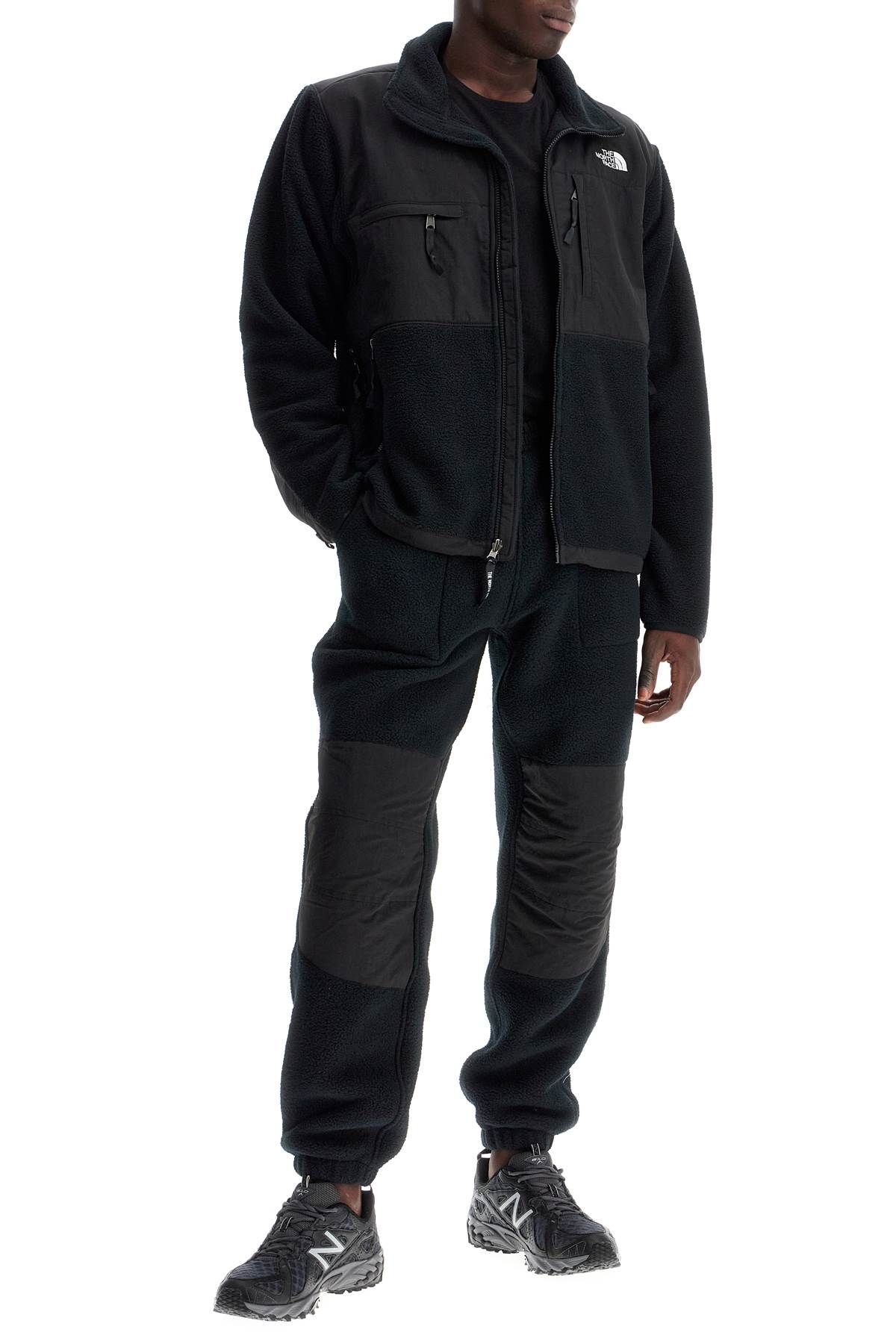 Shop The North Face Retro Denali Fleece Sports Pants. In Black