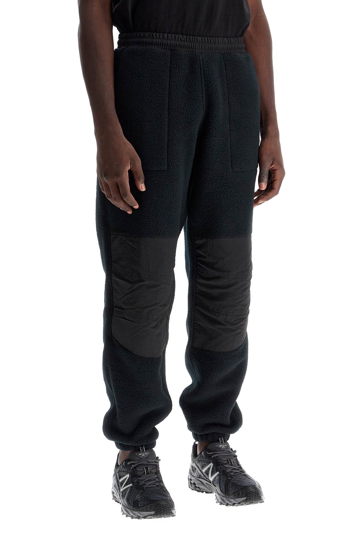 Shop The North Face Retro Denali Fleece Sports Pants. In Black