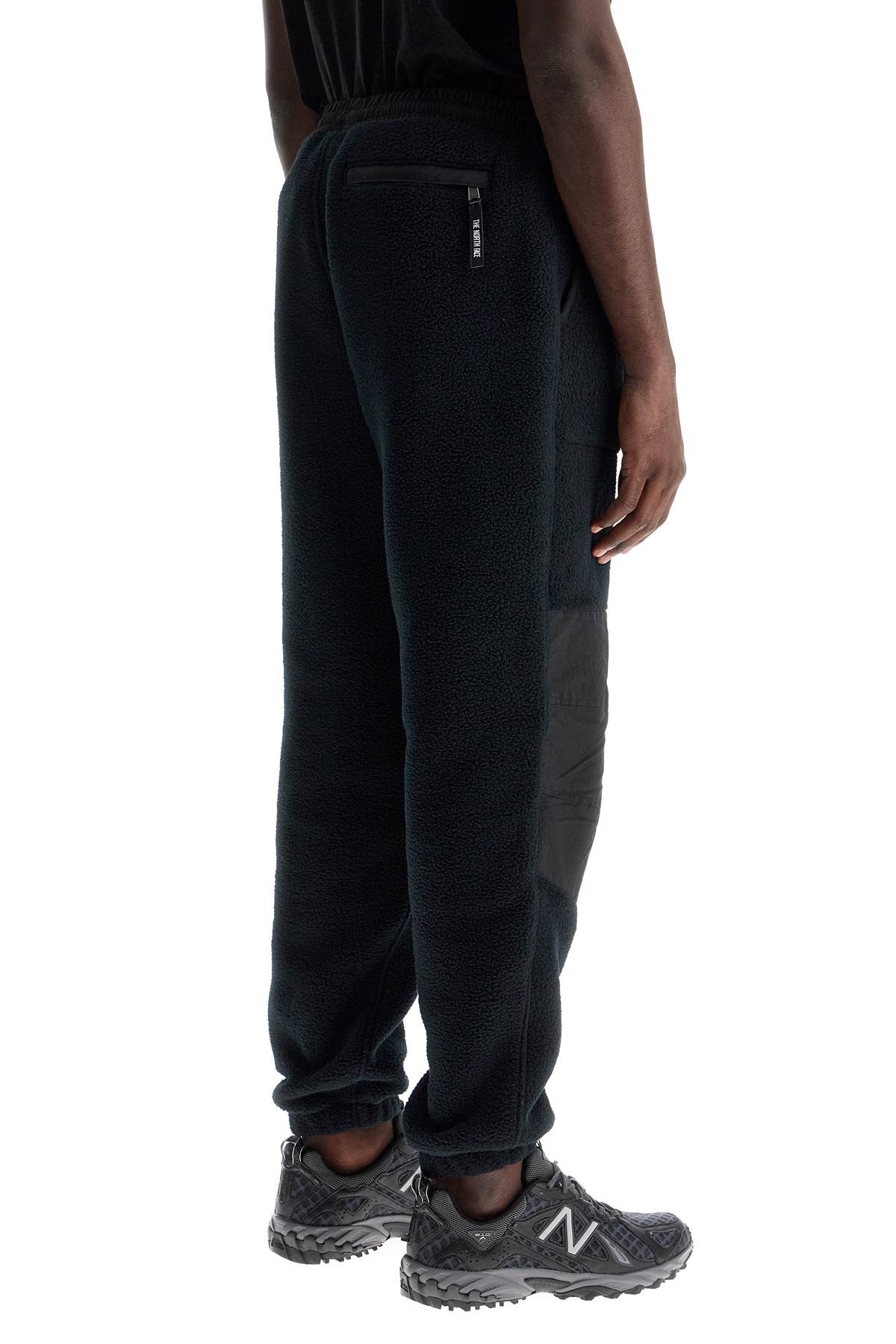 Shop The North Face Retro Denali Fleece Sports Pants. In Black