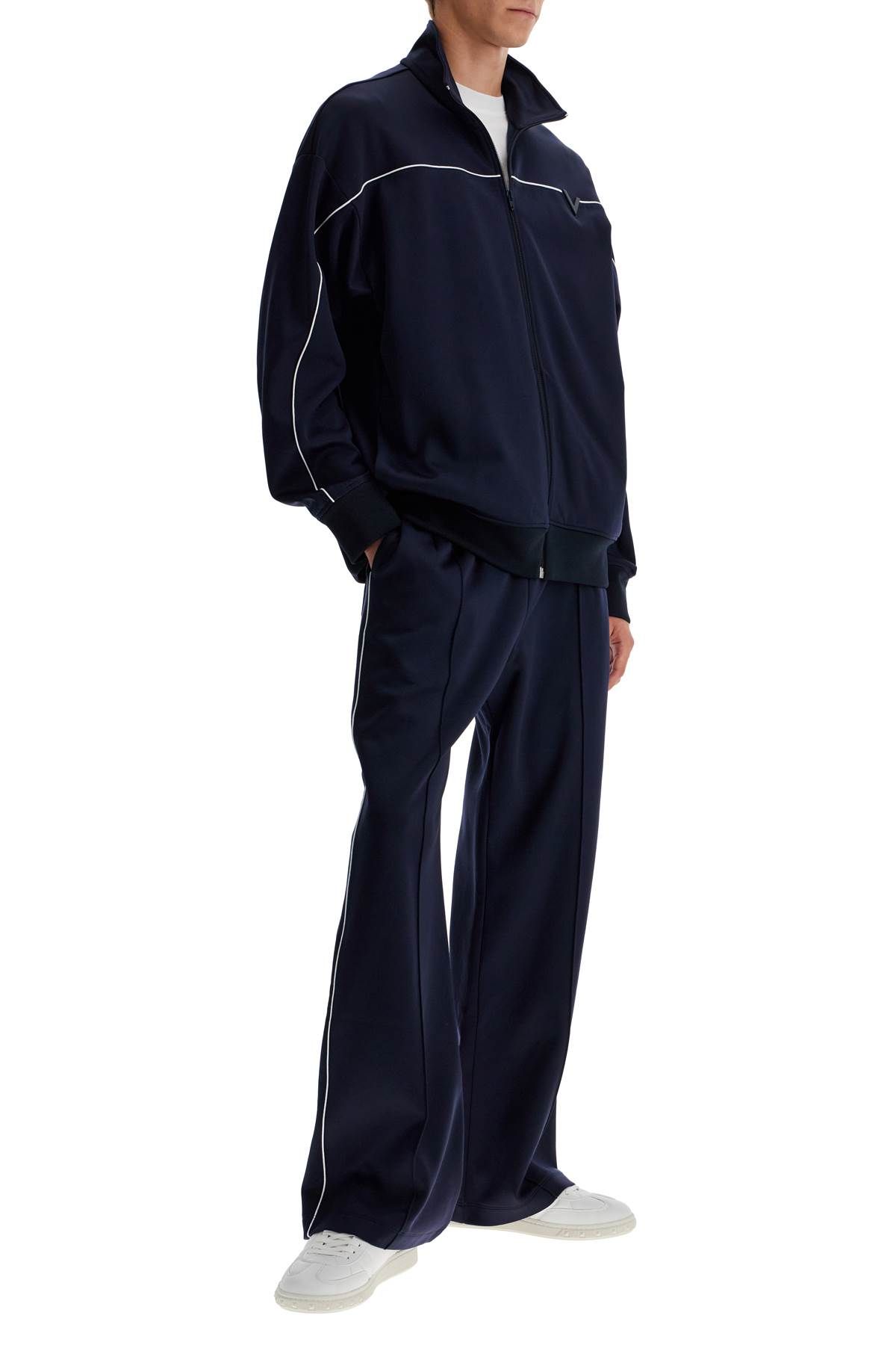 Shop Valentino Jogger Pants With Metallic V Detail In Blue