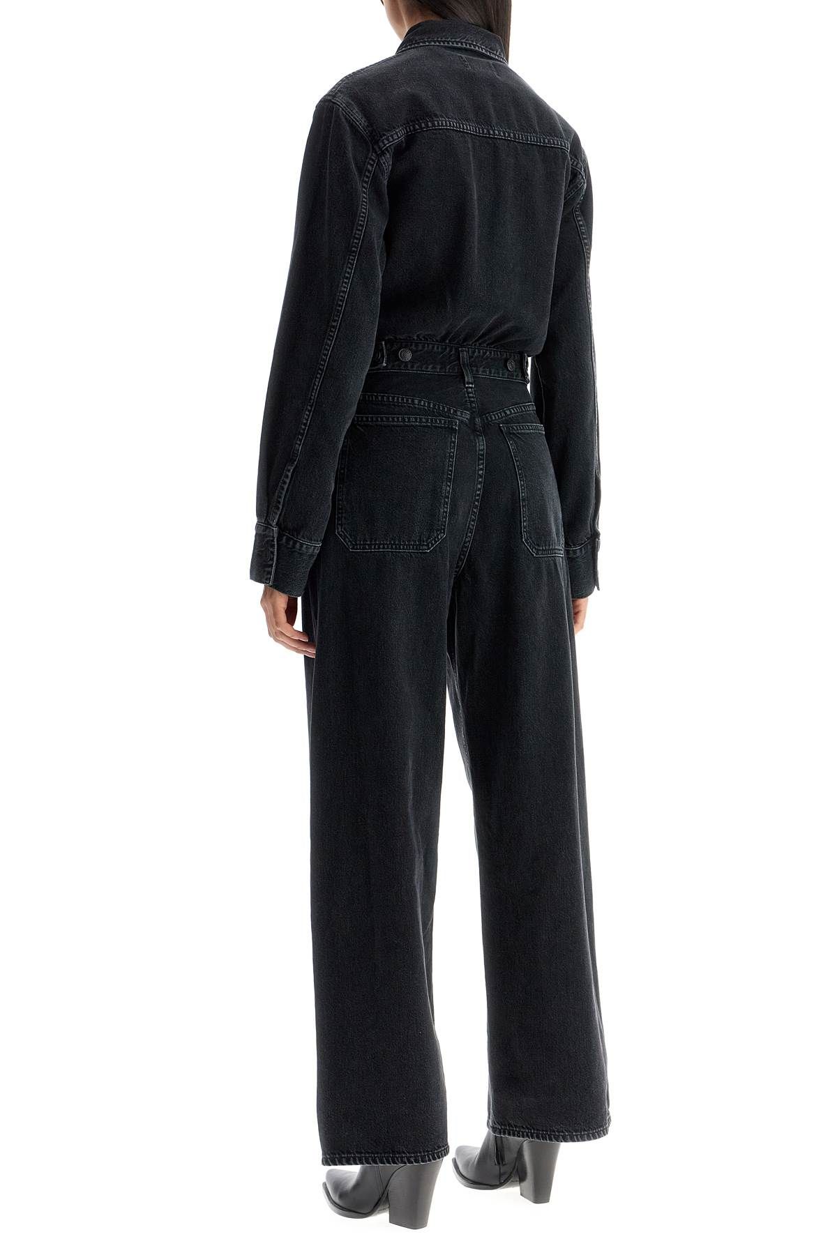 Shop Agolde Denim Tane Jumpsuit In Black