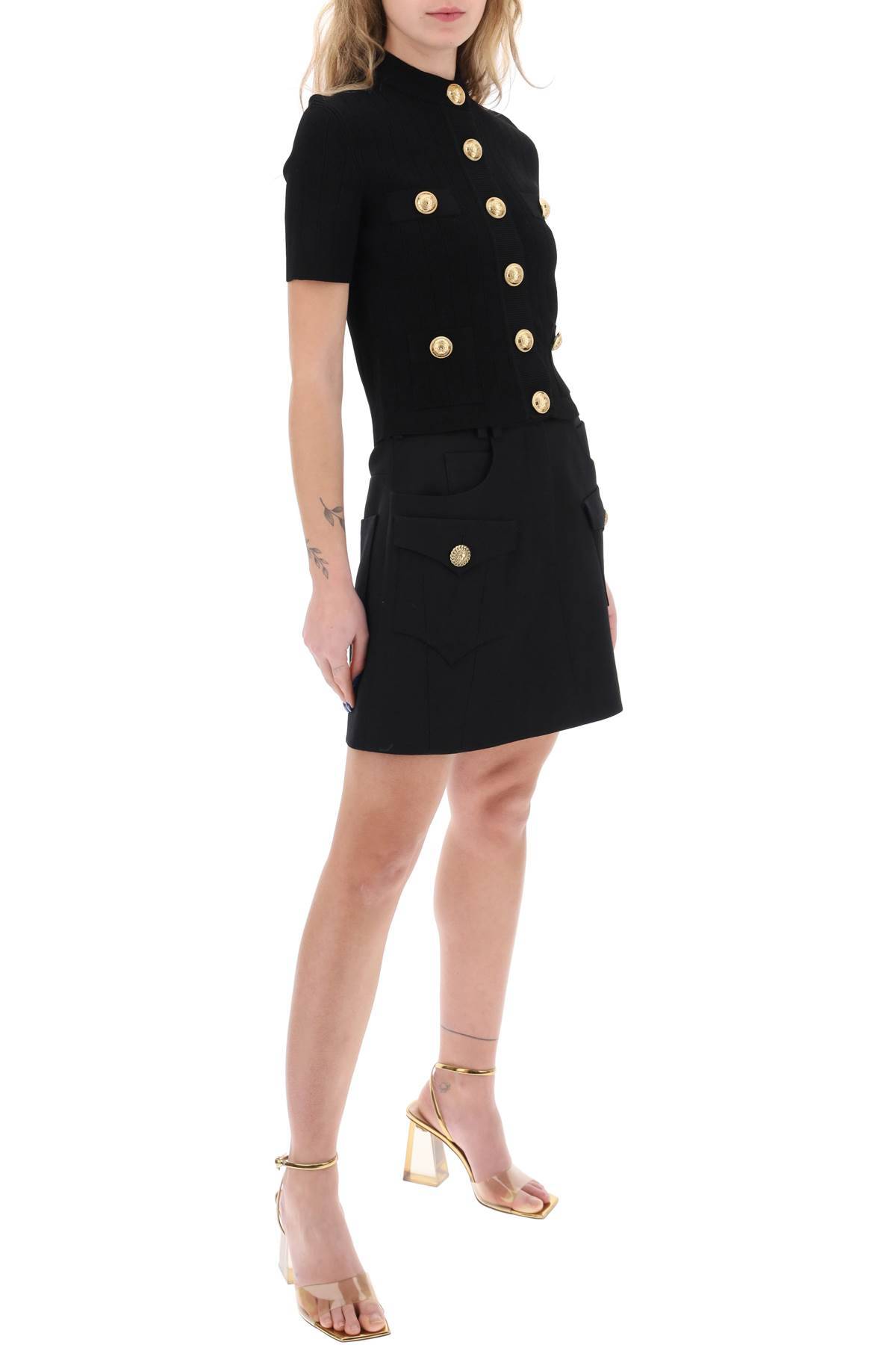 Shop Balmain Trapeze Mini Skirt With Embossed Buttons In Black