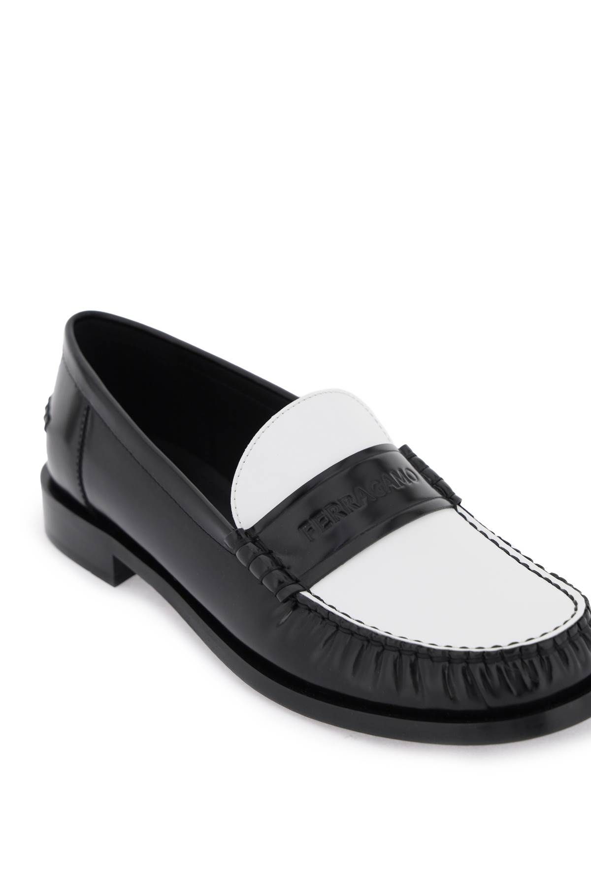 Shop Ferragamo Leather Loafers With Embossed Logo In White,black