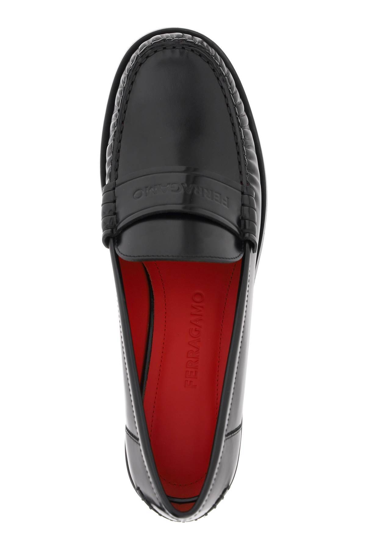 Shop Ferragamo Leather Loafers With Embossed Logo In Black