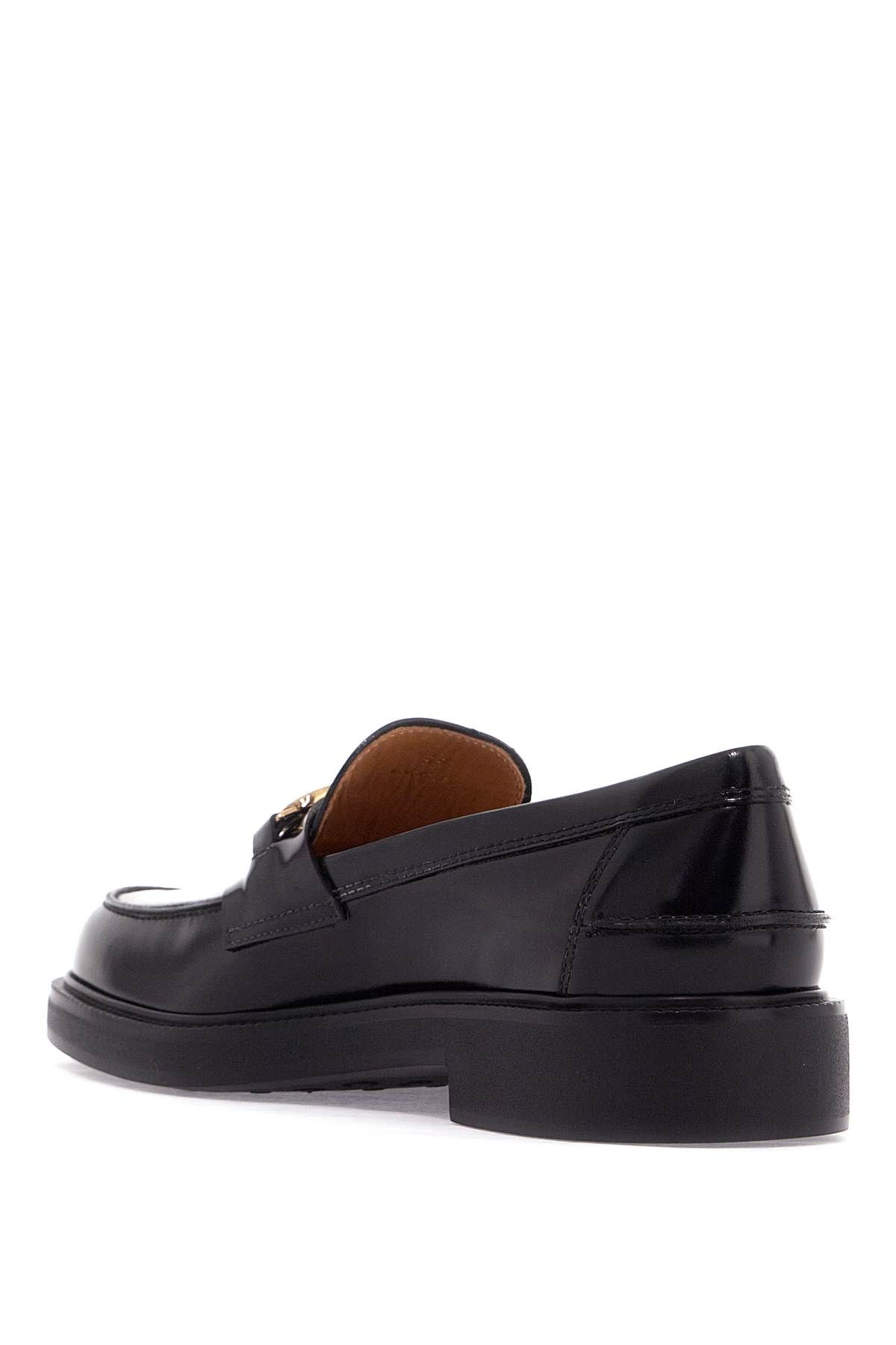 Shop Tod's Metal Logo Loafers With Metal Detailing In Black