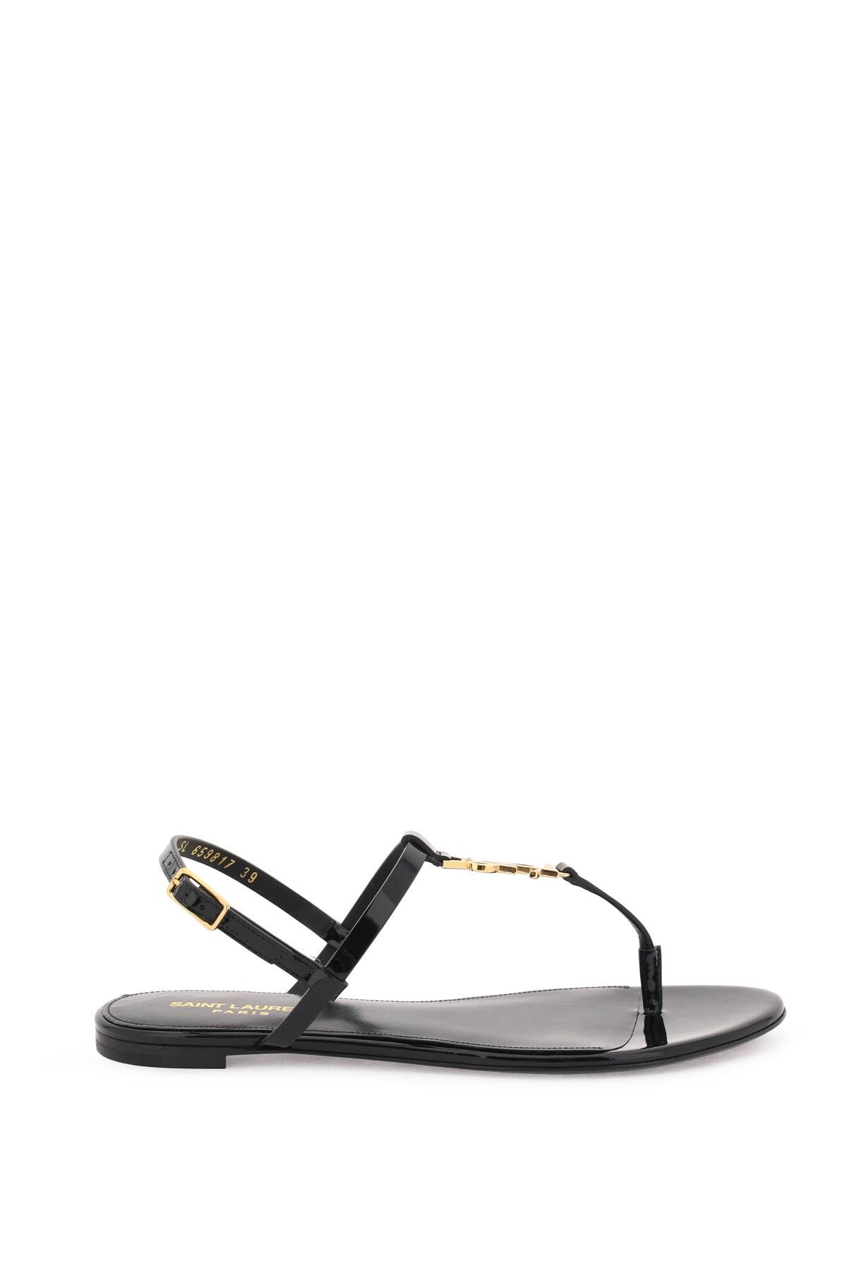 Shop Saint Laurent Patent Leather Cassandra Flat Sandals In Black