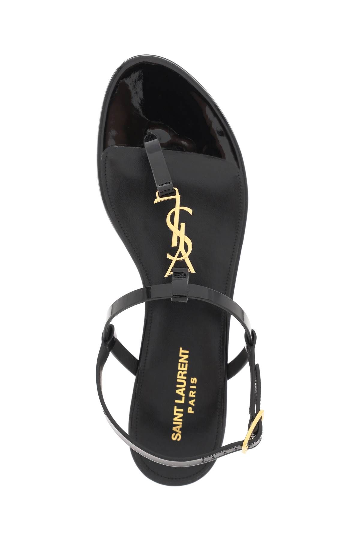 Shop Saint Laurent Patent Leather Cassandra Flat Sandals In Black