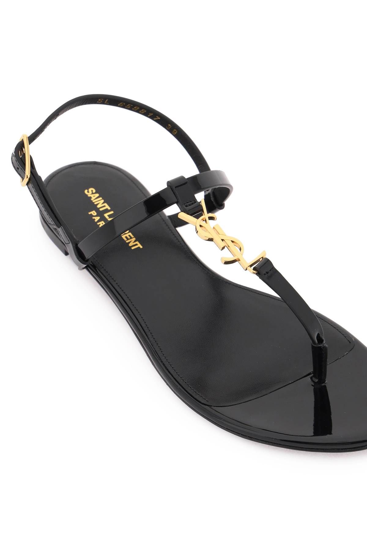 Shop Saint Laurent Patent Leather Cassandra Flat Sandals In Black