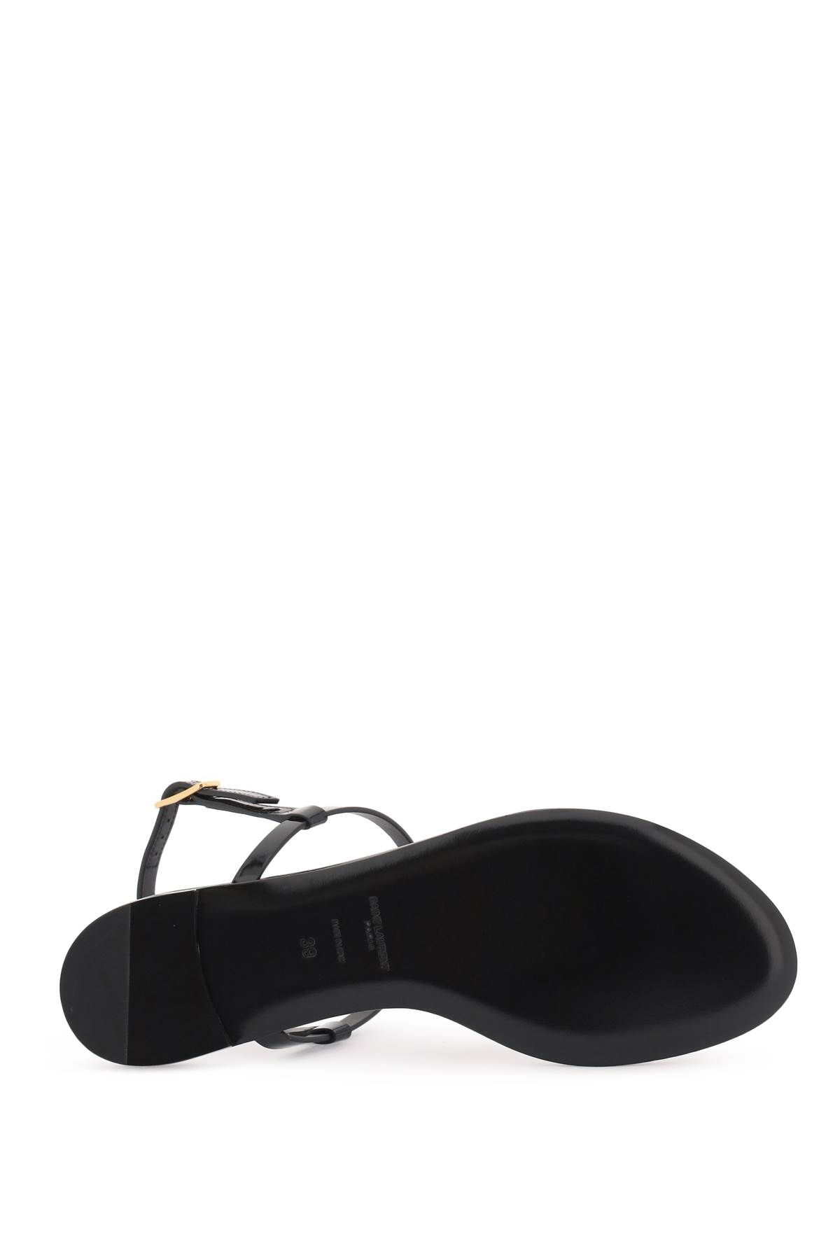 Shop Saint Laurent Patent Leather Cassandra Flat Sandals In Black