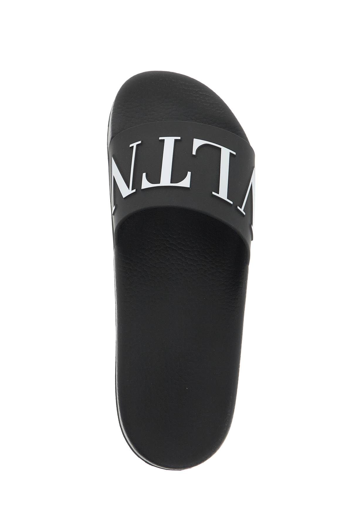 Shop Valentino Vltn Rubber Slides In Black