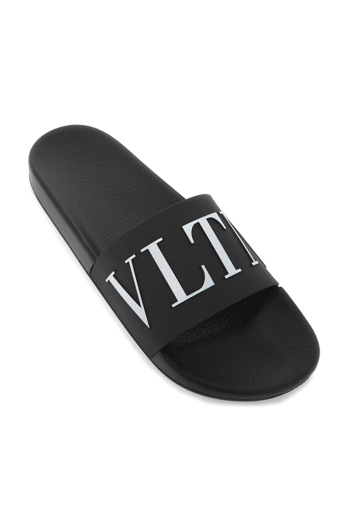 Shop Valentino Vltn Rubber Slides In Black