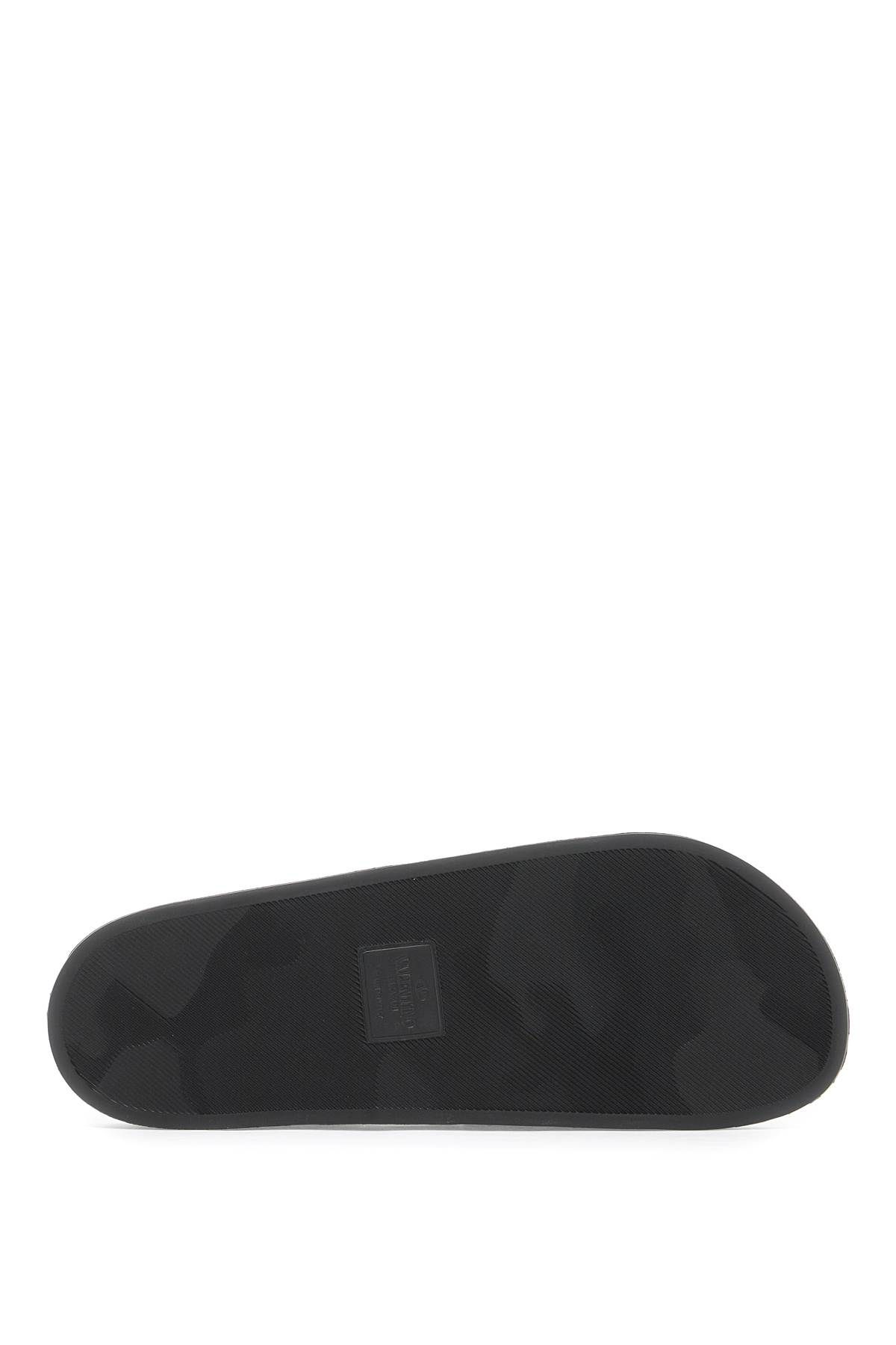 Shop Valentino Vltn Rubber Slides In Black