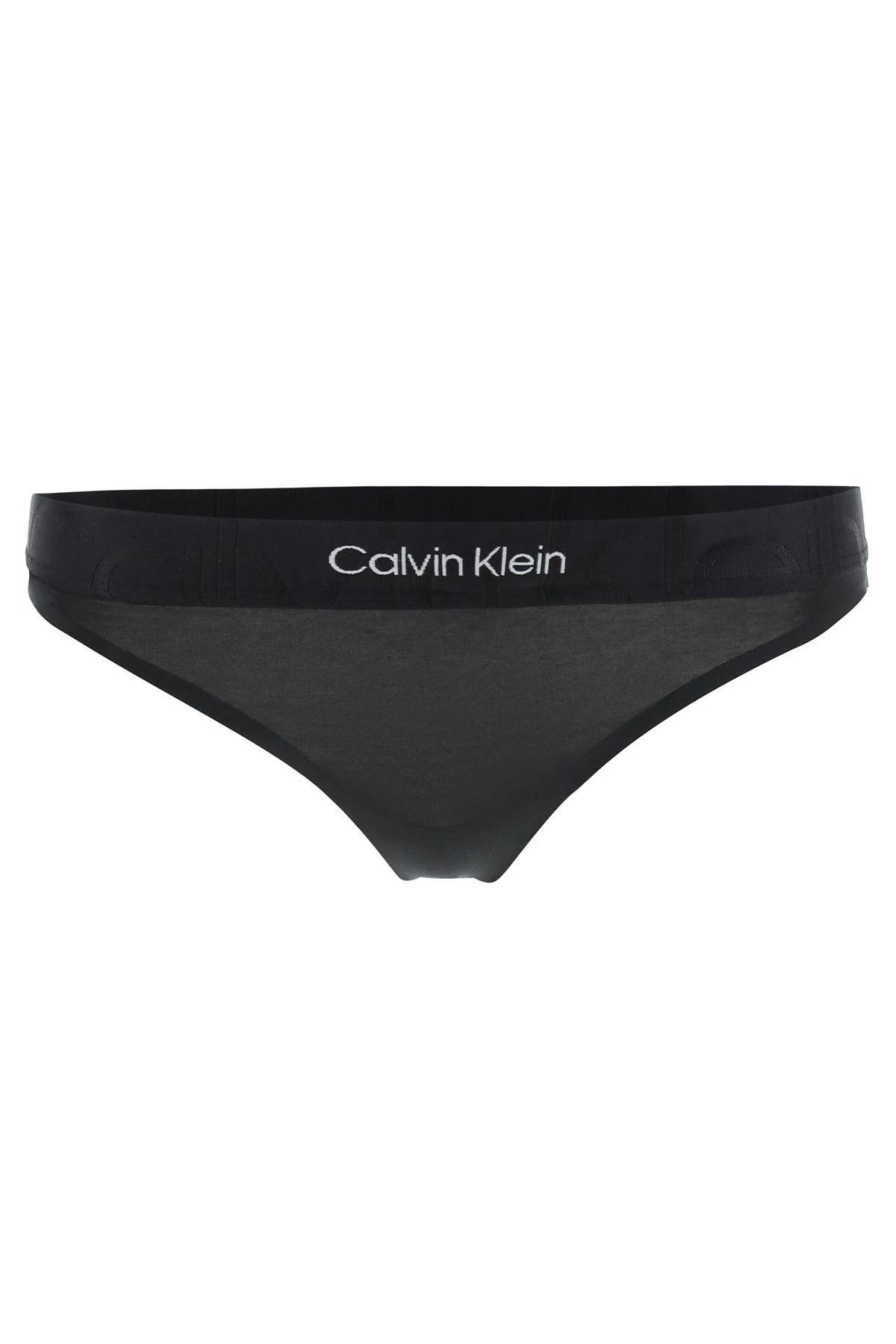 Shop Calvin Klein Underwear Embossed Icon Thong In Black