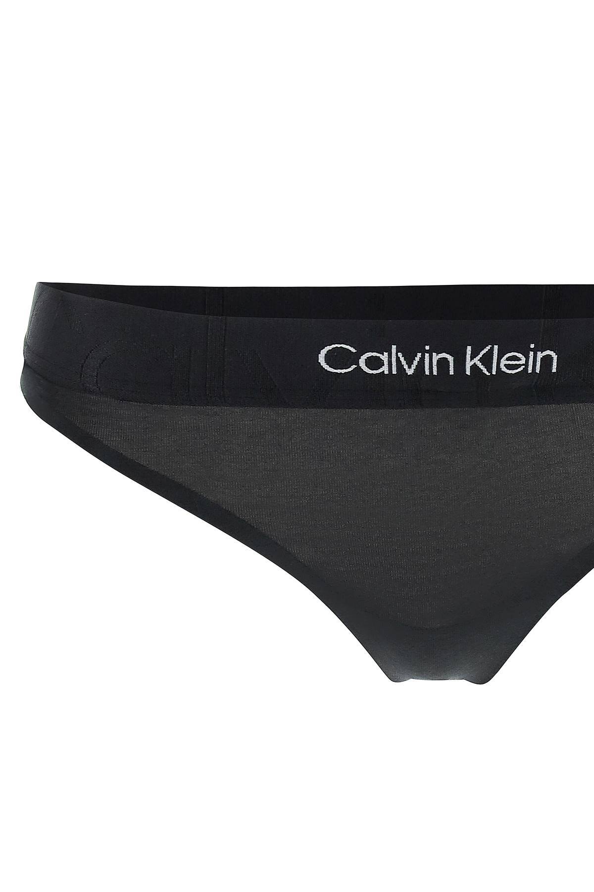 Shop Calvin Klein Underwear Embossed Icon Thong In Black