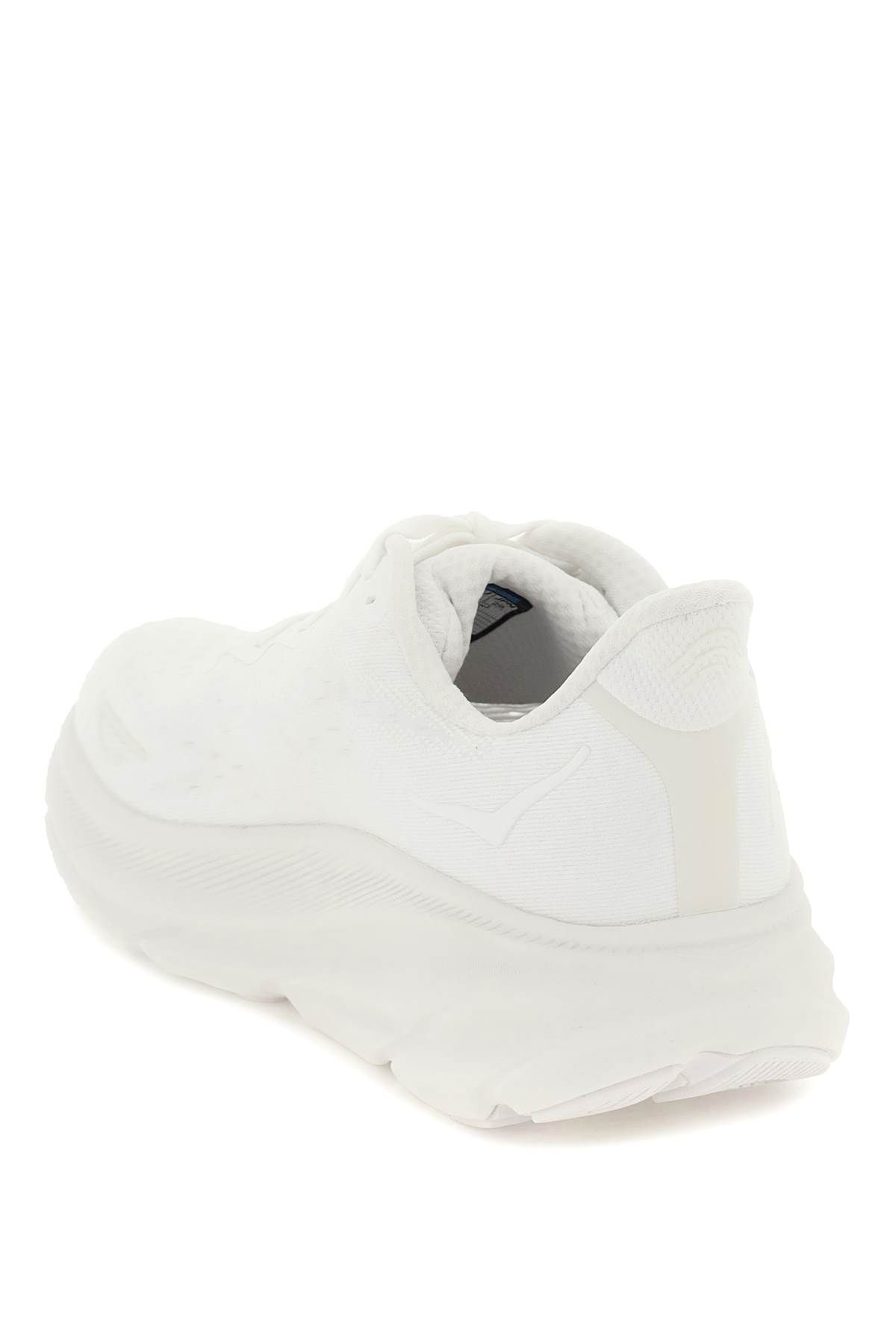 Shop Hoka Clifton 9 Sneakers In White