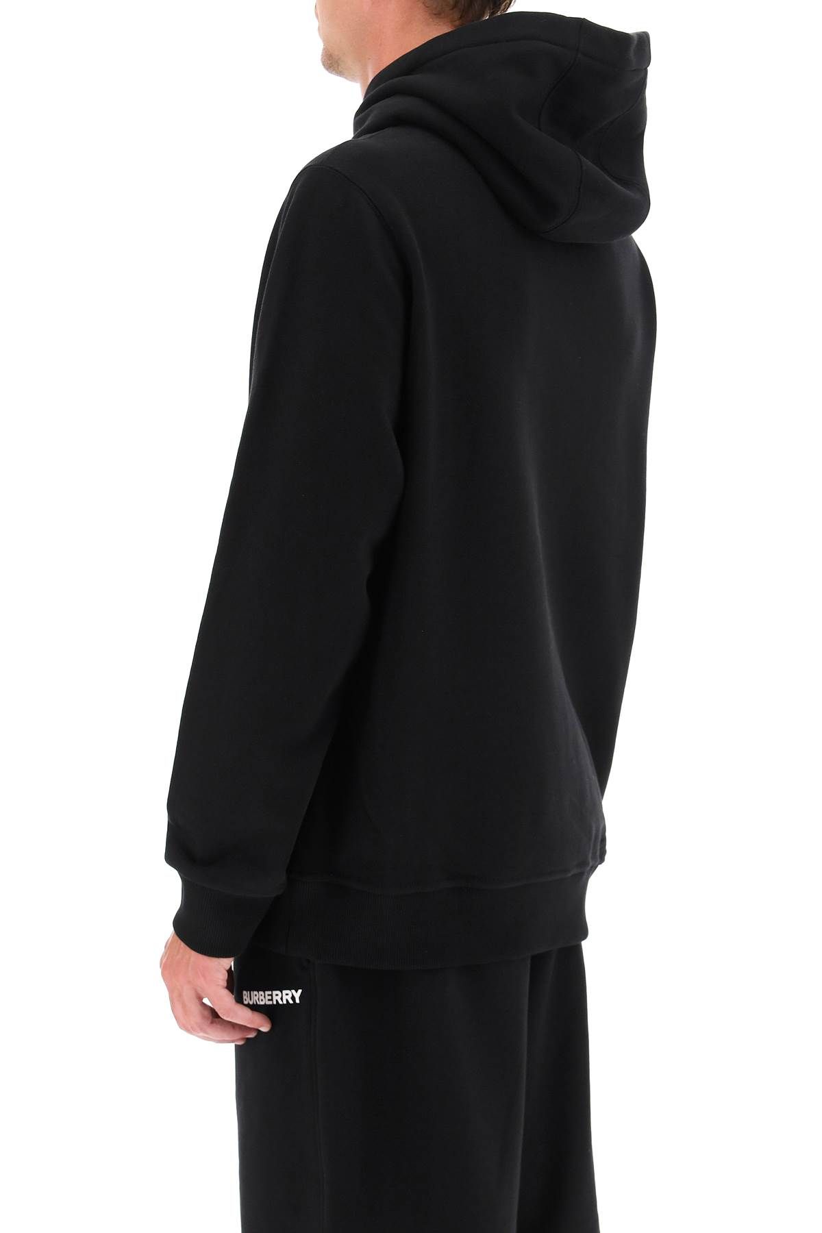 Shop Burberry Logo Hoodie In Black