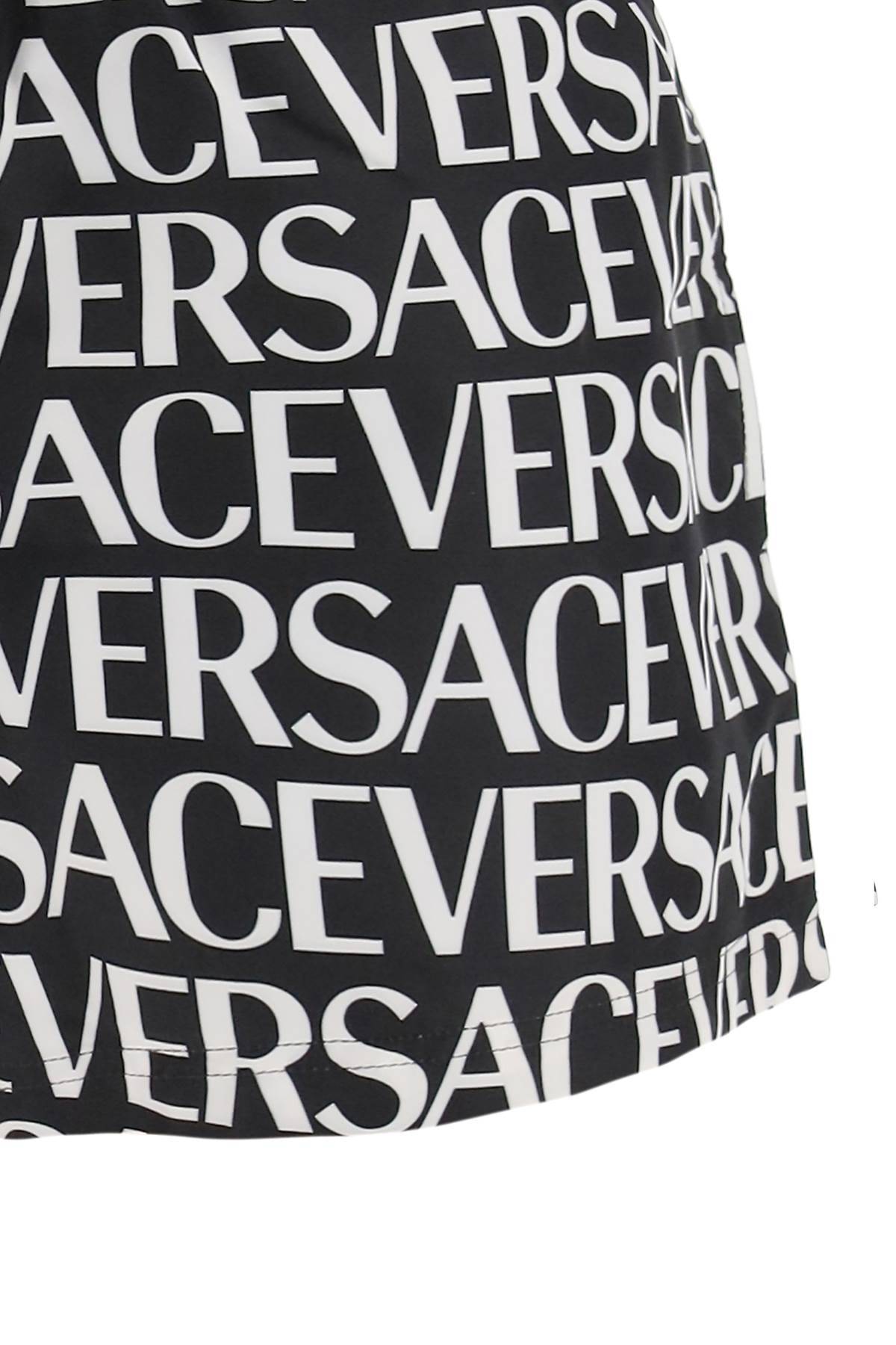 Shop Versace Allover Swim Trunks In White,black