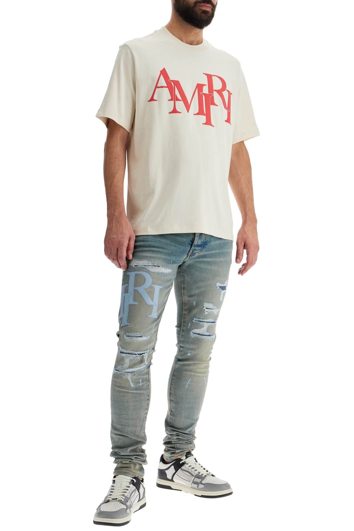 Shop Amiri Staggered Logo In White