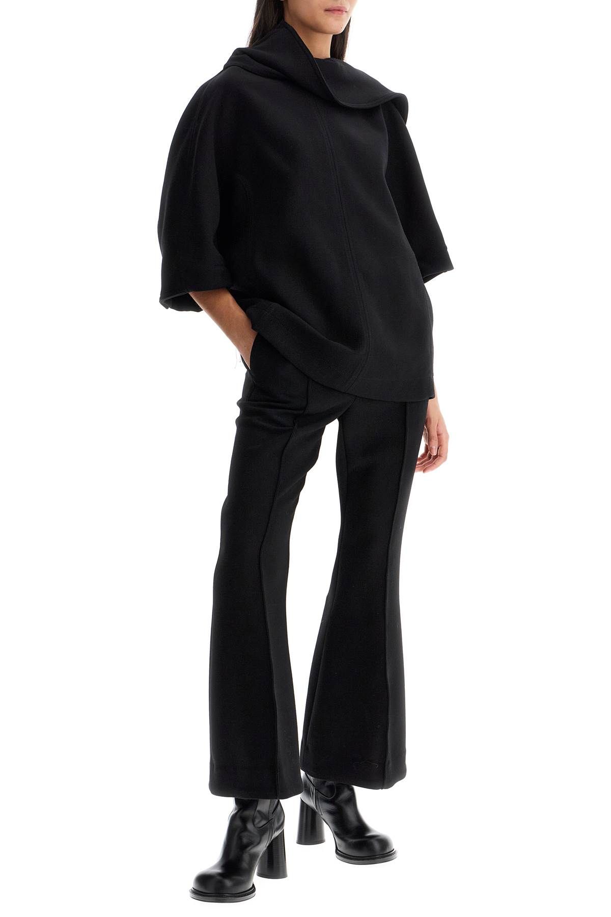 Shop Bottega Veneta Flared Wool Crepe Trousers In Black