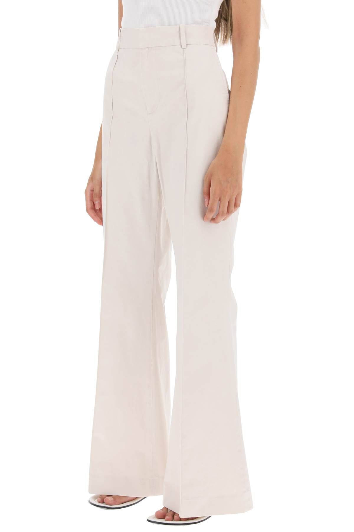 Shop Polo Ralph Lauren Cotton Bootcut Pants In White