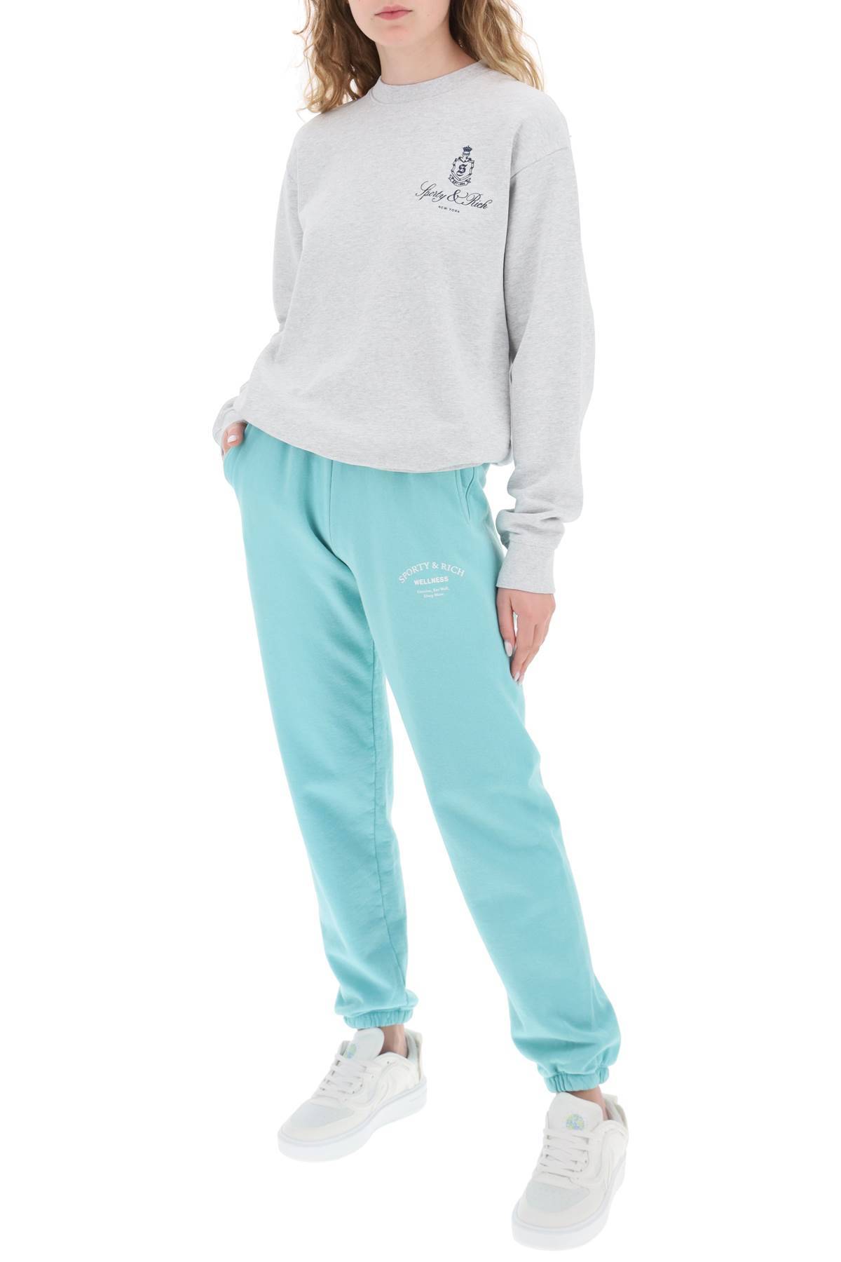 Shop Sporty And Rich Jogger Pants With Printed Logo In Light Blue