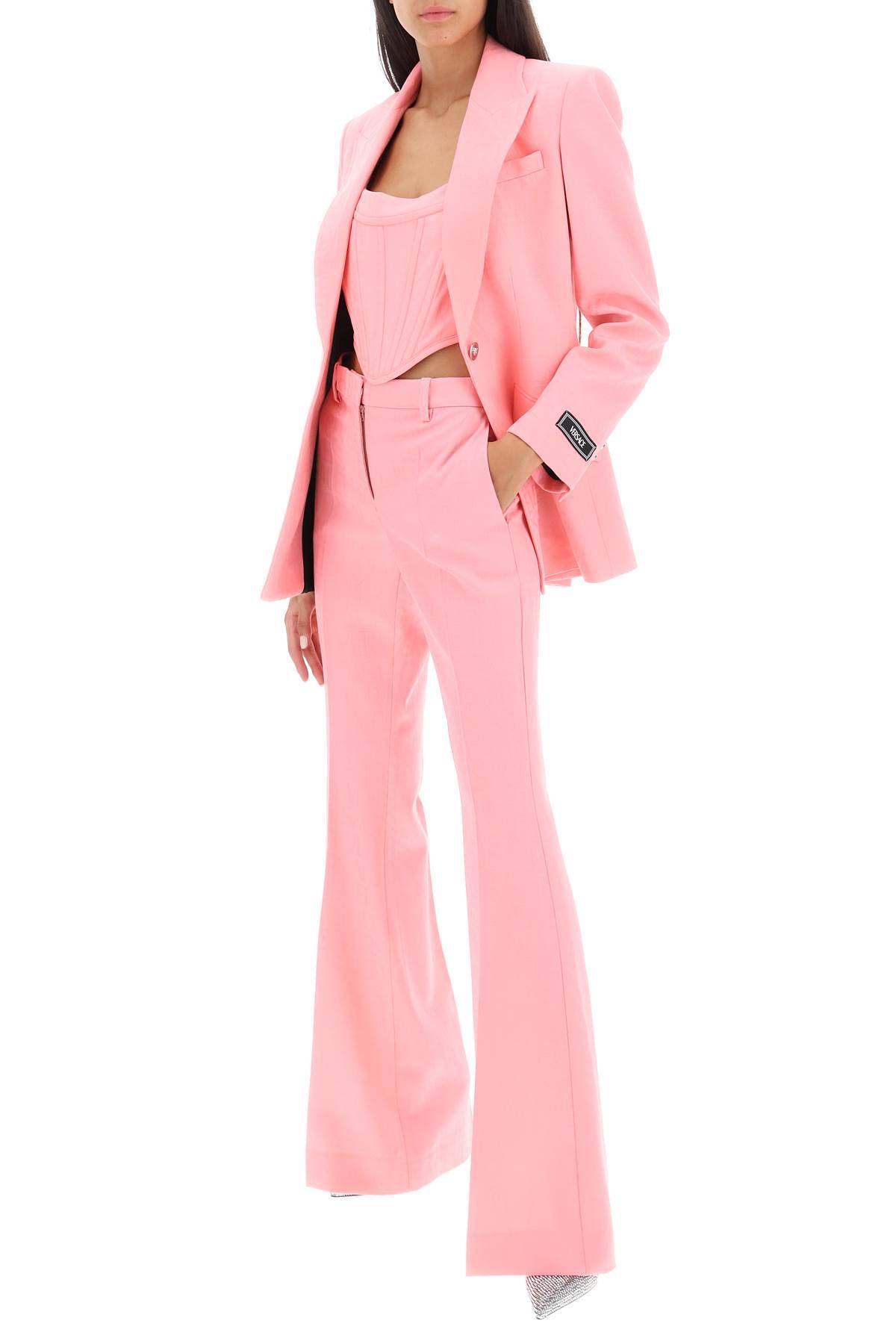 Shop Versace Low Waisted Flared Trousers In Pink
