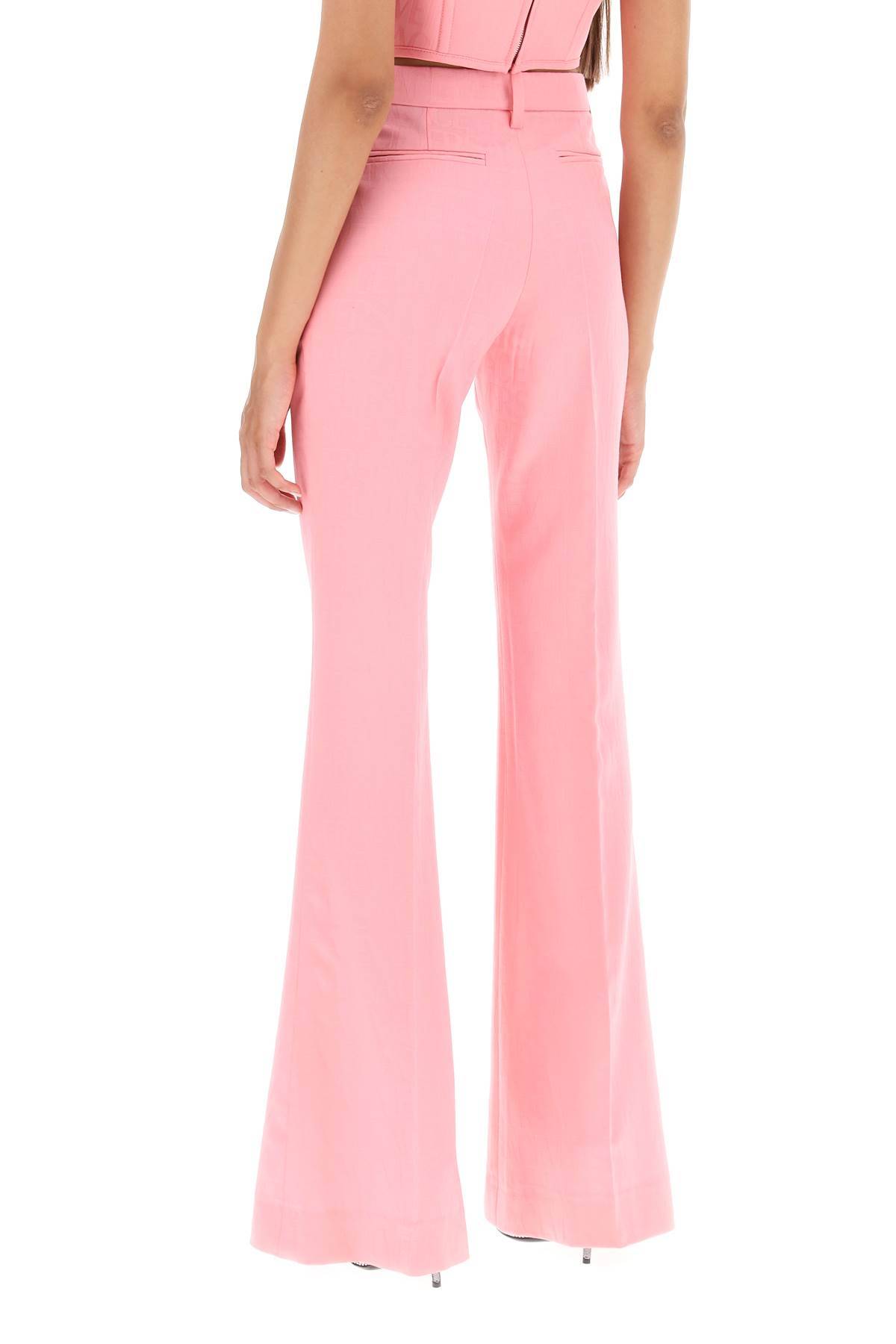 Shop Versace Low Waisted Flared Trousers In Pink